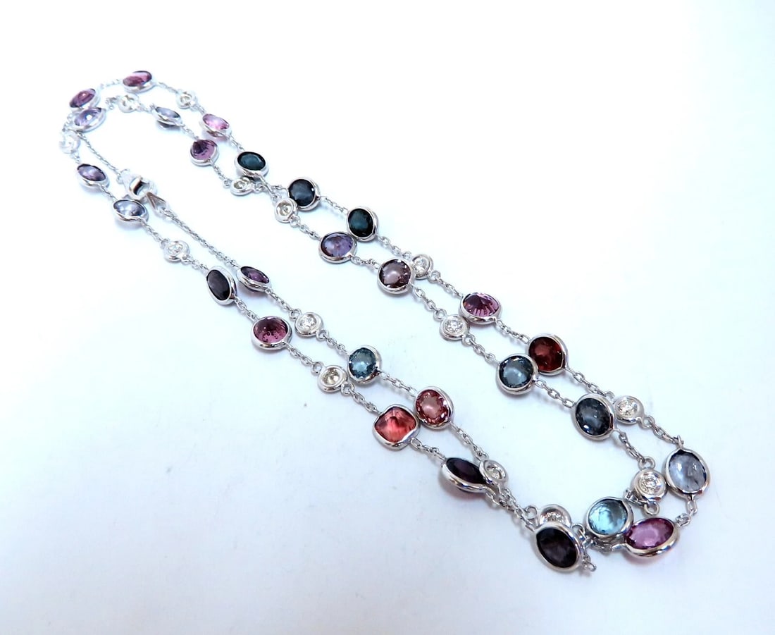 23 carat multi-colored natural spinel diamonds yard necklace 24 inch 14kt gold**: Natural spinel diamonds yard necklace. Ranging colors: pink, greens, red, purple, blue, and teal. Ovals, rounds, and cushion cuts. Average each 5x4 mm Clean Clarity brilliant cuts 1.05 carat natural r