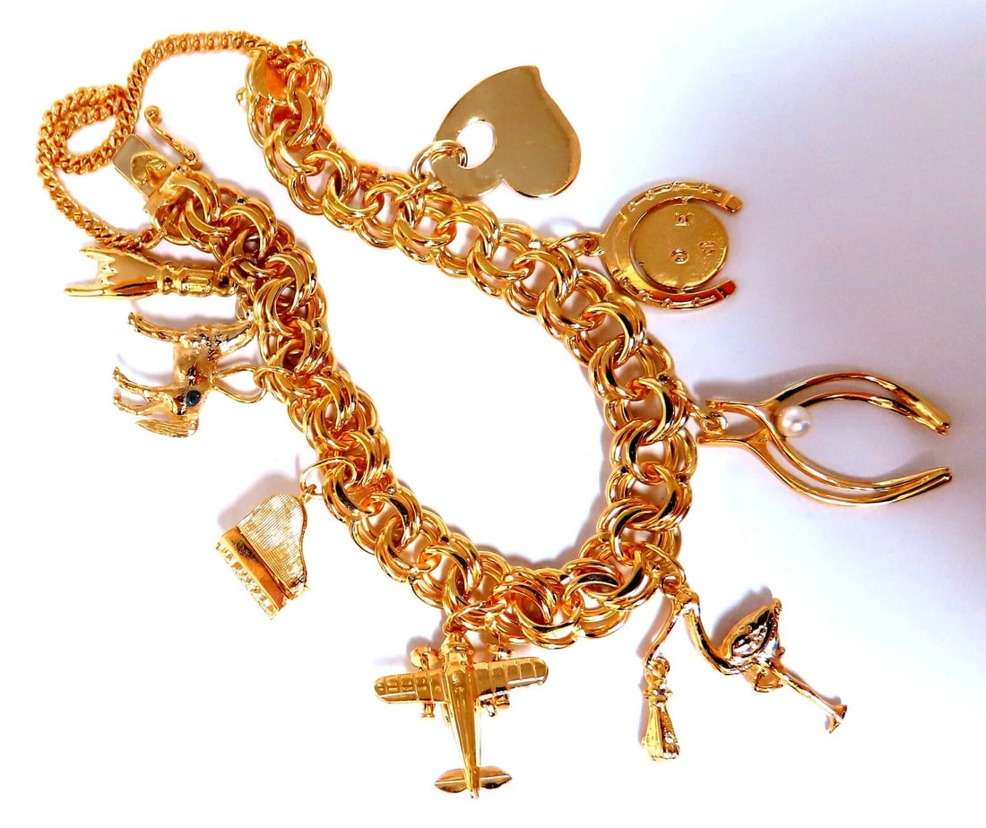 Eight Charms Link Bracelet 14kt gold 7 inch 43gm: 8 charm link bracelet. Hand Horns Horse Piano Airplane Flamingo Wishbone Horseshoe Heart Chain 9mm caliber 14 karat yellow gold 43 grams Bracelet measure 7-in Secure lock & Chain ....*. <b