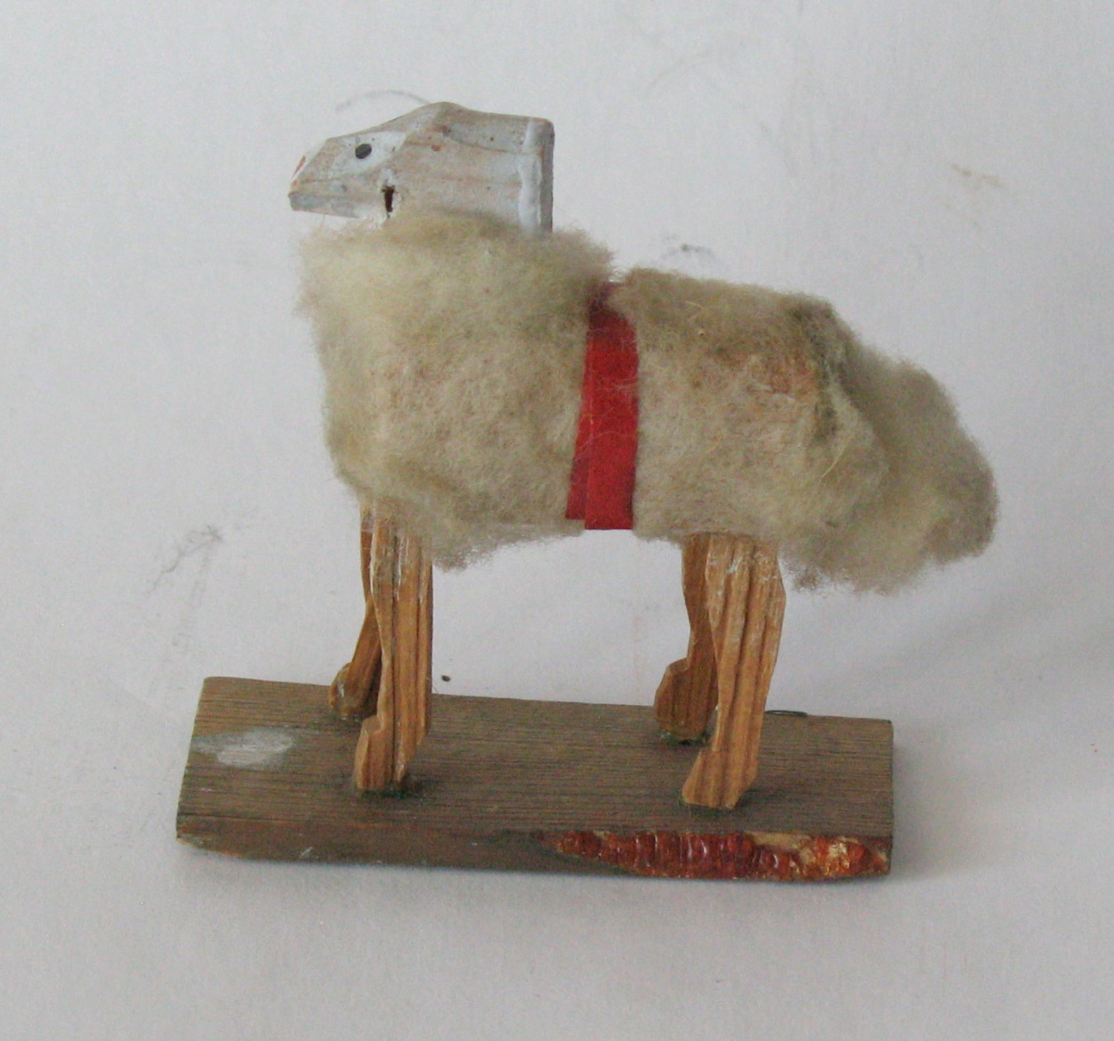 Antique German woolly sheep on platform.: Title: Antique German woolly sheep on platform. Date/Period: 1900's Dimension: 2 1/2” x 1 1/4” x 2 1/2” high Additional Information: Nice antique German woolly sheep on platform in g