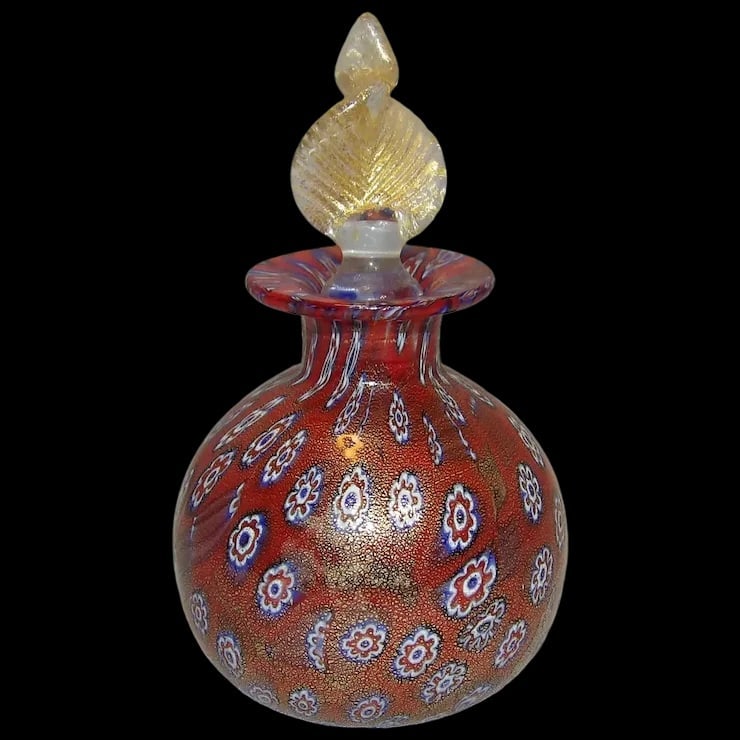 Miniature Millefiori Murano Venetian Italian Blown Art Glass Gold Fleck Perfume Bottle with Stopper: This Miniature Millefiori Murano Venetian Italian Blown Art Glass Gold Fleck Perfume Bottle with Stopper Circa 1980’s is in excellent condition. It measures 3 ¾” with stopper and is -