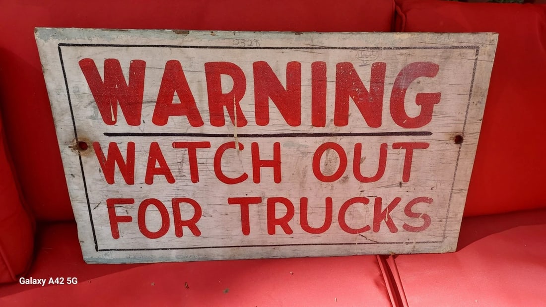 WATCH OUT FOR TRUCKS sign 1950 14 X 24 PAINT ON WOOD: Great looking piece in good condition. Great look. On old thin plywood. Dates to 1950's. Measures approximately 14 x 24". Shipping includes insurance. Shipping: Domestic: Flat-rate of $35.00 to anywhe