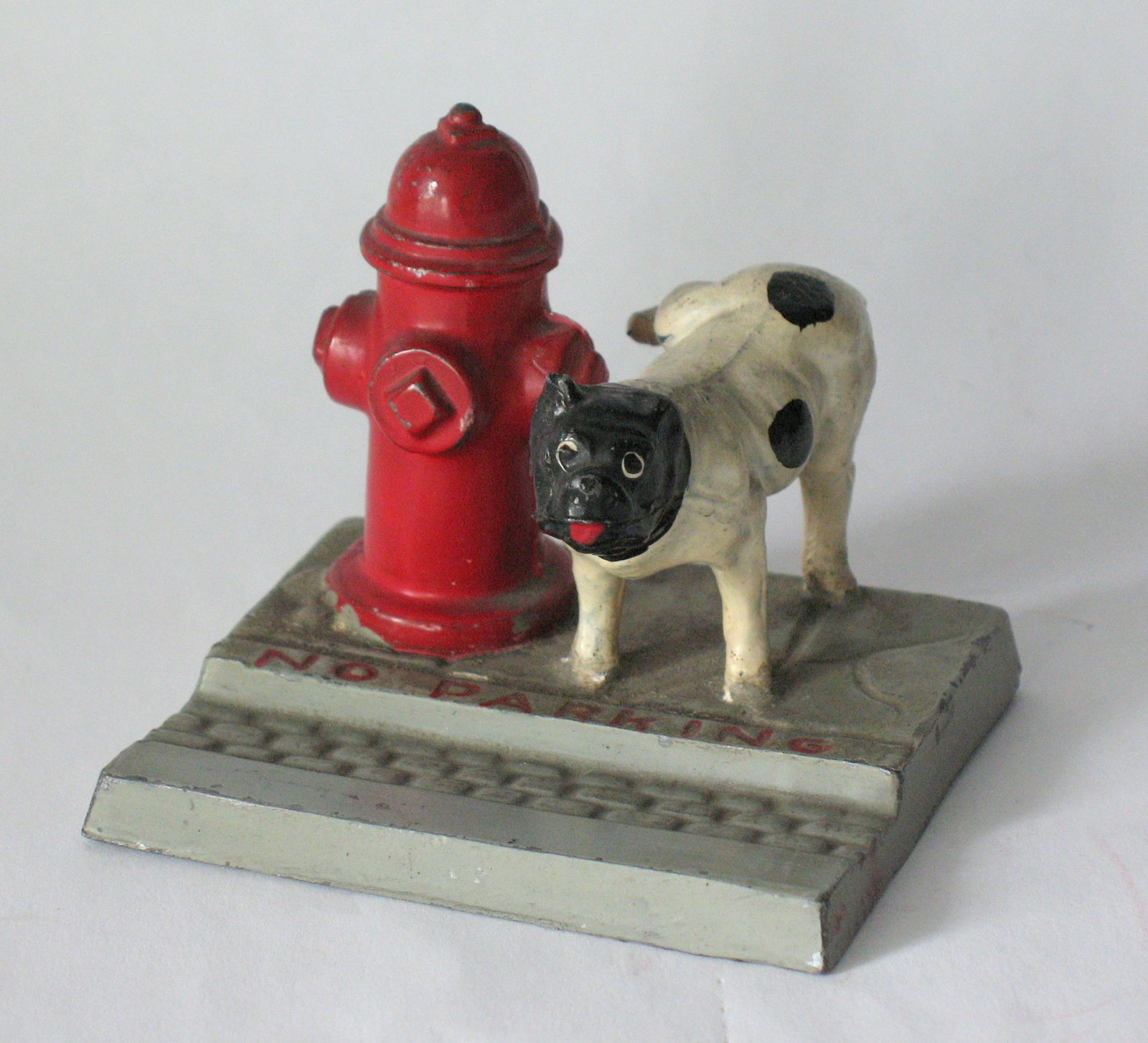 Antique cast metal dog at the fire hydrant paper weight. (1 of 6)