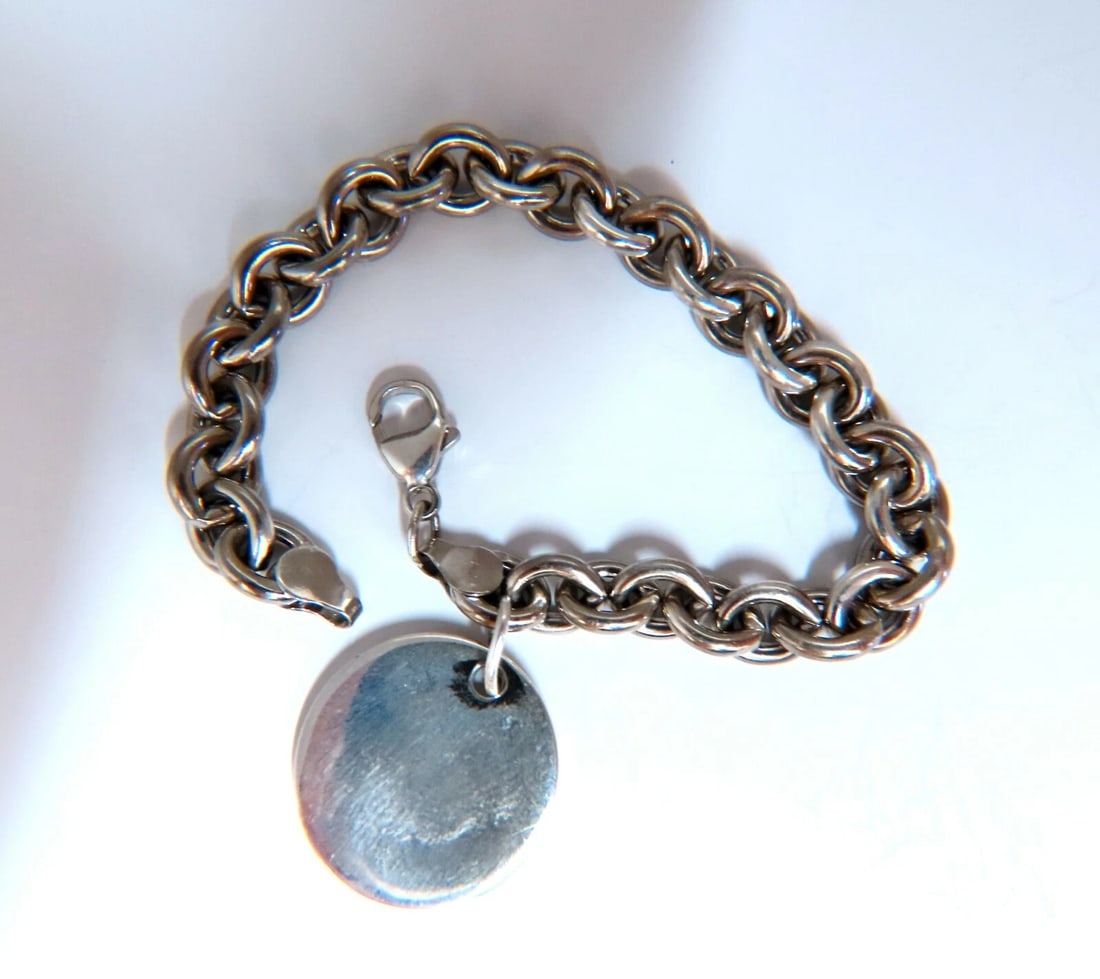 Sterling Silver Disc Toggle Charm Link Bracelet: Sterling Silver Toggle & charm disc Link Bracelet 7 Inch Disc: 22mm diameter 8mm links Sterling silver 30 grams Free Insured overnight shipping. All Items come with a Free White ribbon gift box. .....