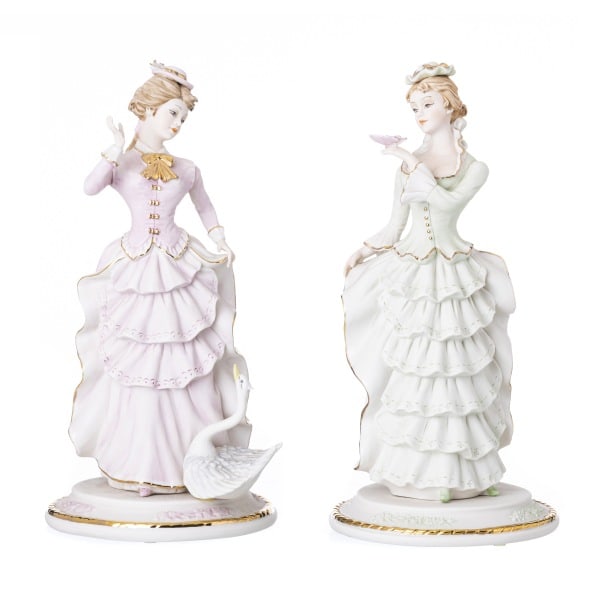 TWO FEMALE FIGURES: Description: TWO FEMALE FIGURES. 20th-century Italian porcelain sculptures from Capodimonte, signed Vittorio Sabadin. Hand-painted polychrome and gilded decoration. Height: 33 cm. Date/Period: Unknown