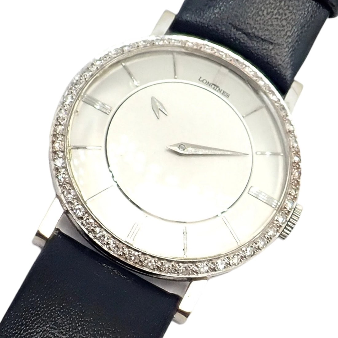 Vintage Longines 18k White Gold Diamond Bezel Manual Wind Mystery Dial Watch: Vintage Longines 18k White Gold Diamond Bezel Manual Wind Mystery Dial Watch About This Piece: The Vintage Longines 18k White Gold Diamond Bezel Manual Wind Mystery Dial Watch is a stunning timepiece.