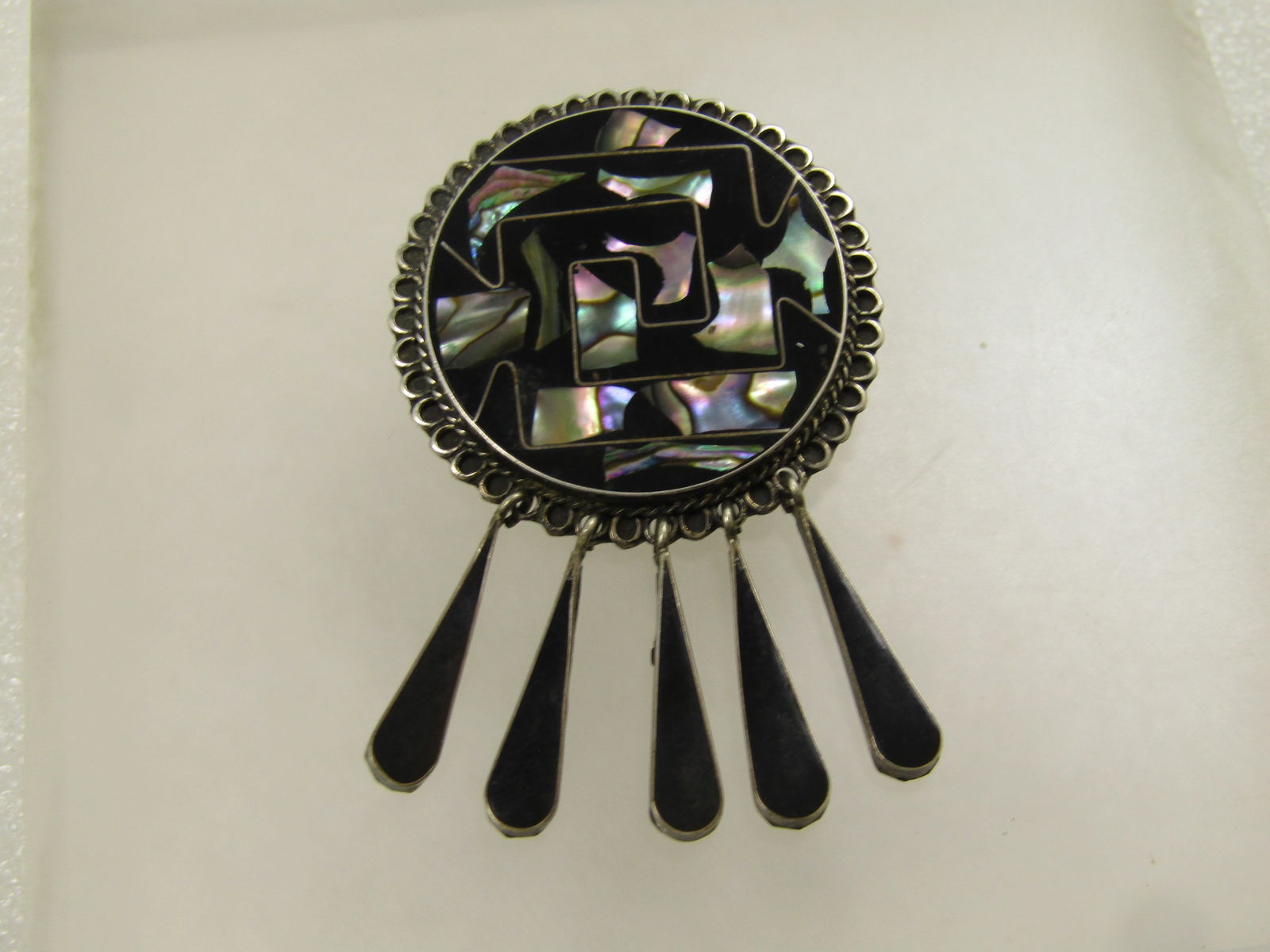 Vintage Sterling Taxco Inlaid Abalone Dangle Brooch/Pendant, 1960's-1970's: Vintage Sterling Taxco Inlaid Abalone Dangle Brooch/Pendant, 1960's-1970's. The black background is not onyx but believed to be black resin. It has abalone pieces set throughout the geometric maze on