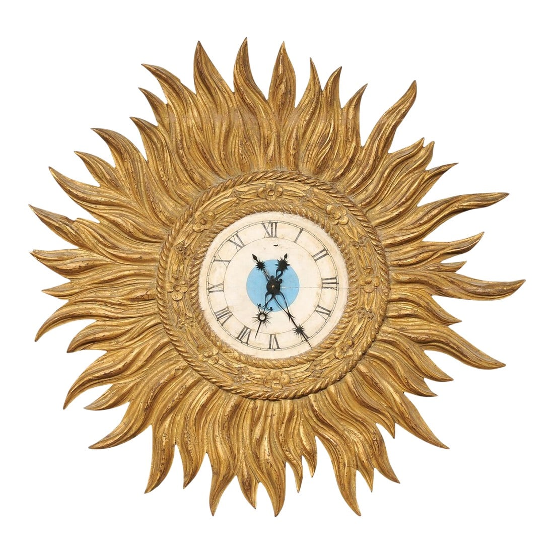 Mid 20th Century Spanish Gold Sunburst Wall Clock: A Spanish decorative sunburst wall clock. This vintage wall clock from Spain, approximately 3 feet in diameter, has a circular-shaped clock set at its center, with an inner rope and floral carved fram