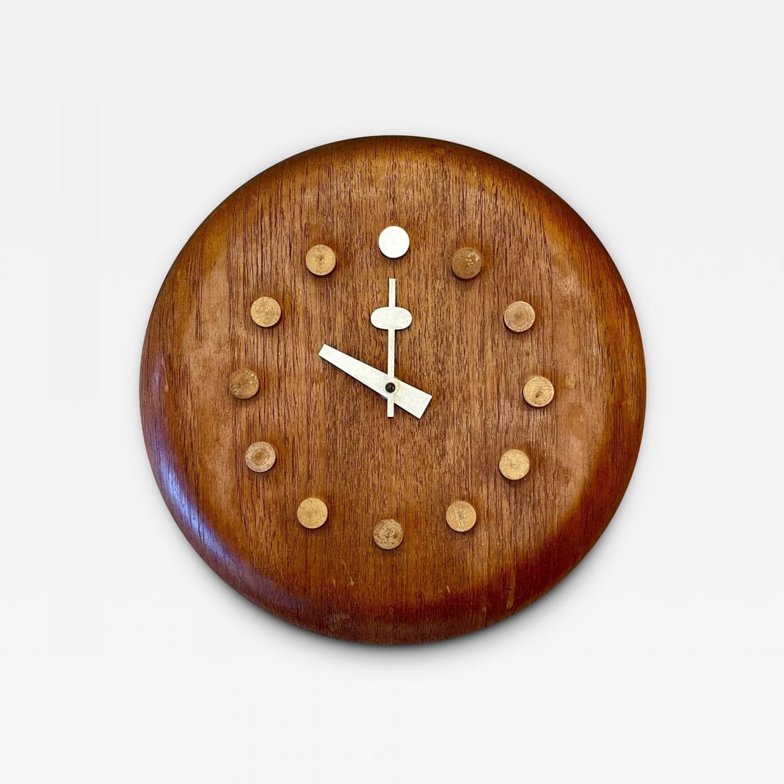 Mid-Century Modern Danish Wall Clock by Fritz Hansen, George Nelson, Teak, 1957: Title: Mid-Century Modern Danish Wall Clock by Fritz Hansen, George Nelson, Teak, 1957 Description: Stool seat wall clock, model 7512, c. 1957 by Fritz Hansen. This finely decorative wall clock is sim