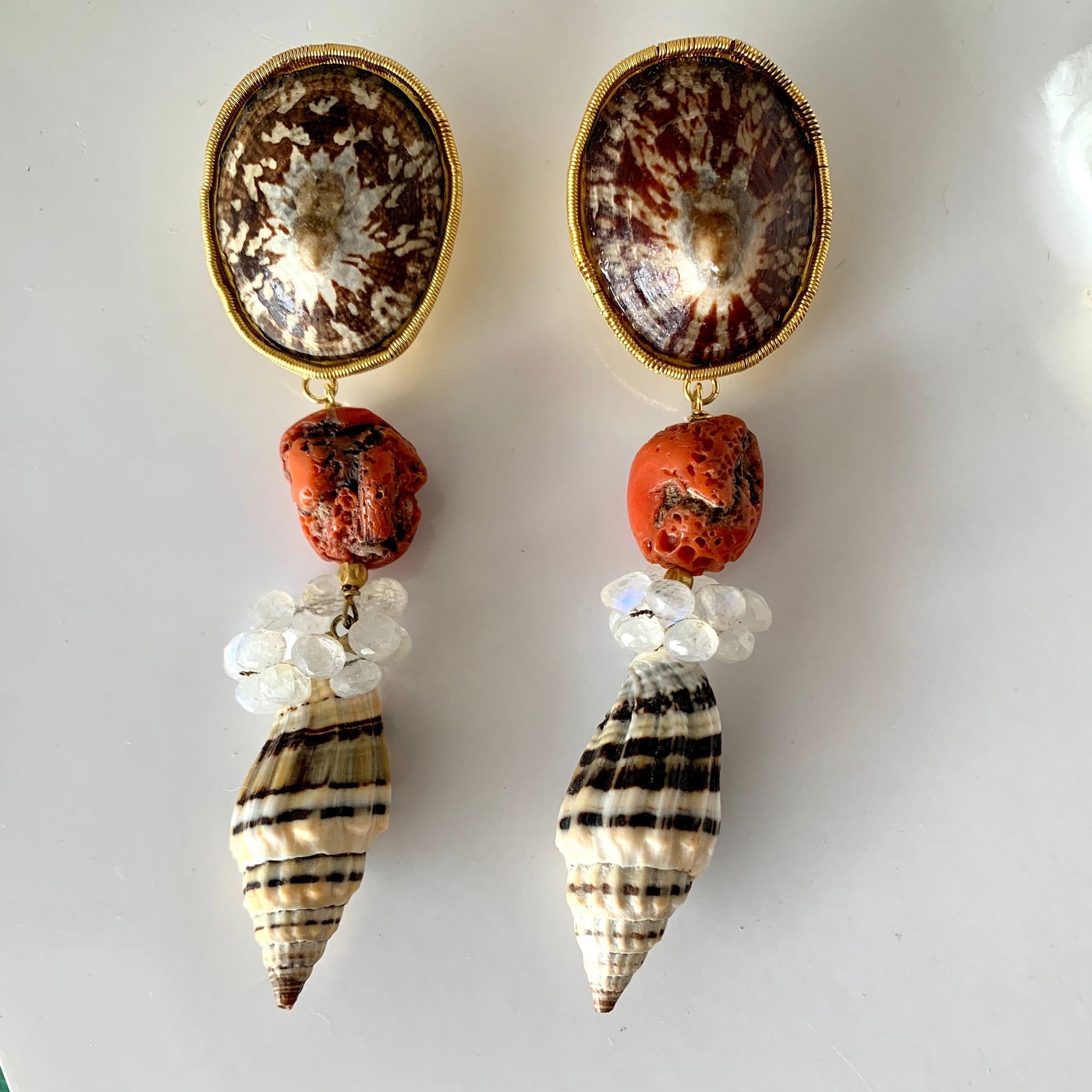 Limpet, Raw Coral, Moonstone, Shell Vermeil Earrings: Title:Limpet, Raw Coral, Moonstone, Shell Vermeil Earrings Description:Chunky with that ancient but polished look, this pair of Vermeil earrings has Limpet tops with large, raw Italian Coral beads. Dr
