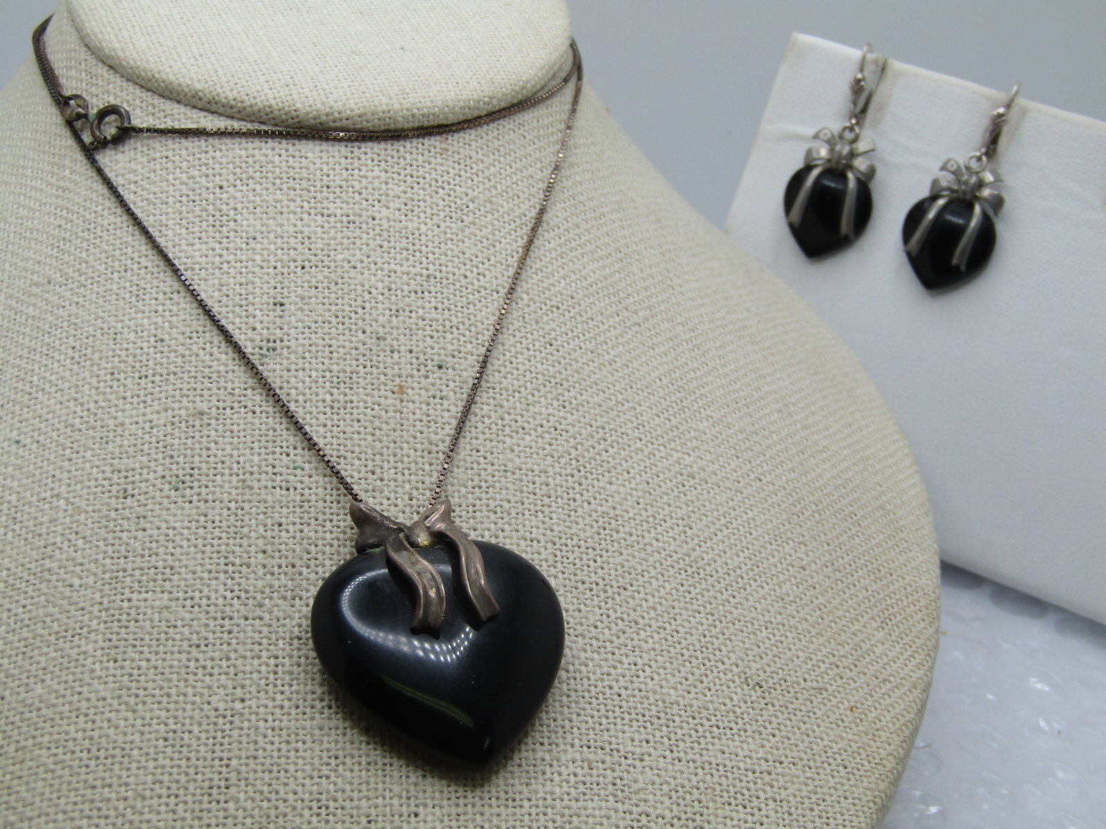Vintage Sterling Onyx Heart Necklace & Earrings, 24", Pierced Leverback: Title: Vintage Sterling Onyx Heart Necklace & Earrings, 24", Pierced Leverback Description: Vintage Sterling Onyx Heart Necklace & Earrings, 24", Pierced Leverback, 1.5" long with bows over the center