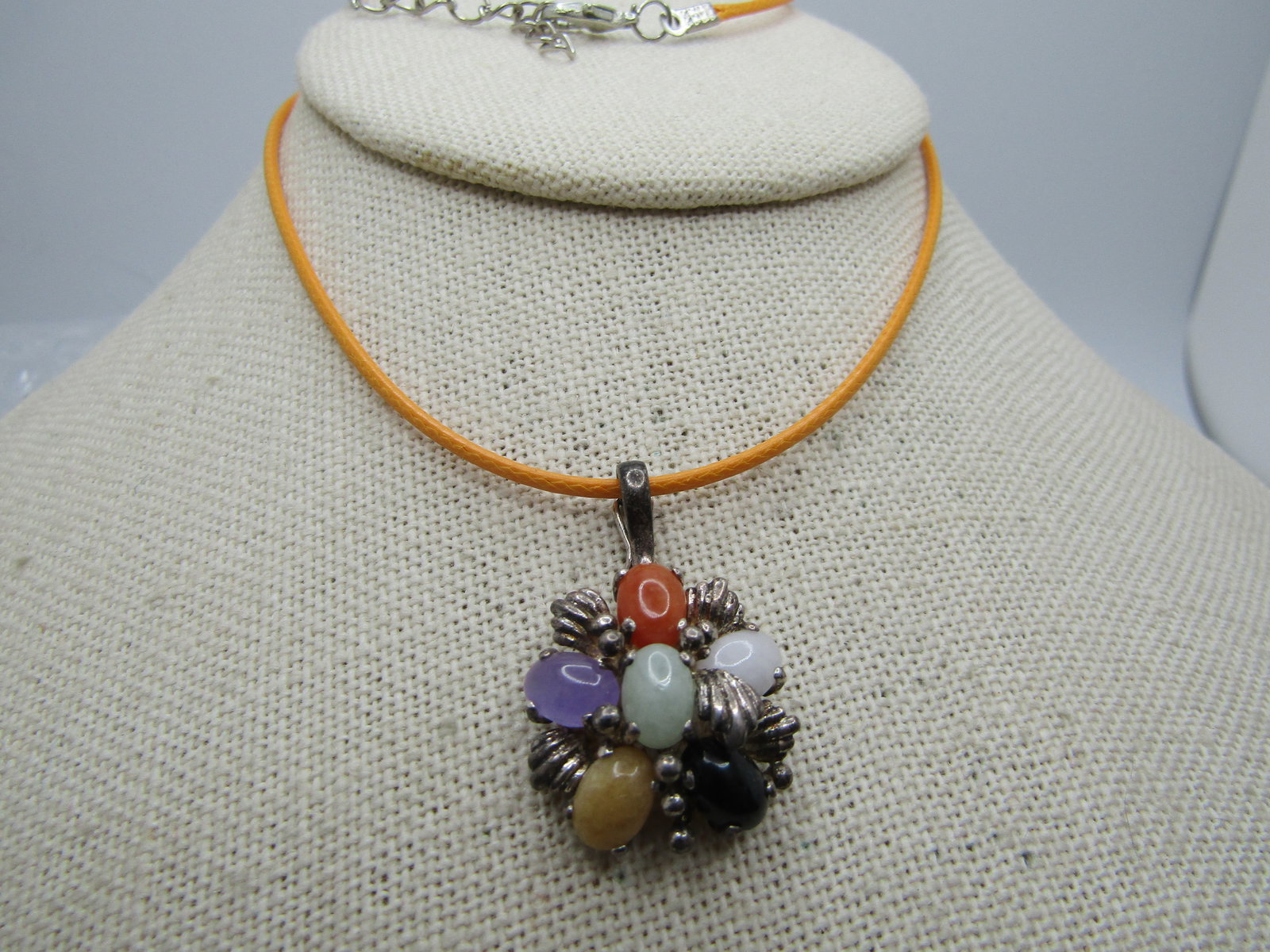 Vintage Sterling Mixed Colored Jade Necklace, 20": Title: Vintage Sterling Mixed Colored Jade Necklace, 20" Description: Vintage Sterling Mixed Colored Jade/Onyx Necklace, 20". Tiered oval cabochons of onyx, green, purple, yellow, and orange jade with