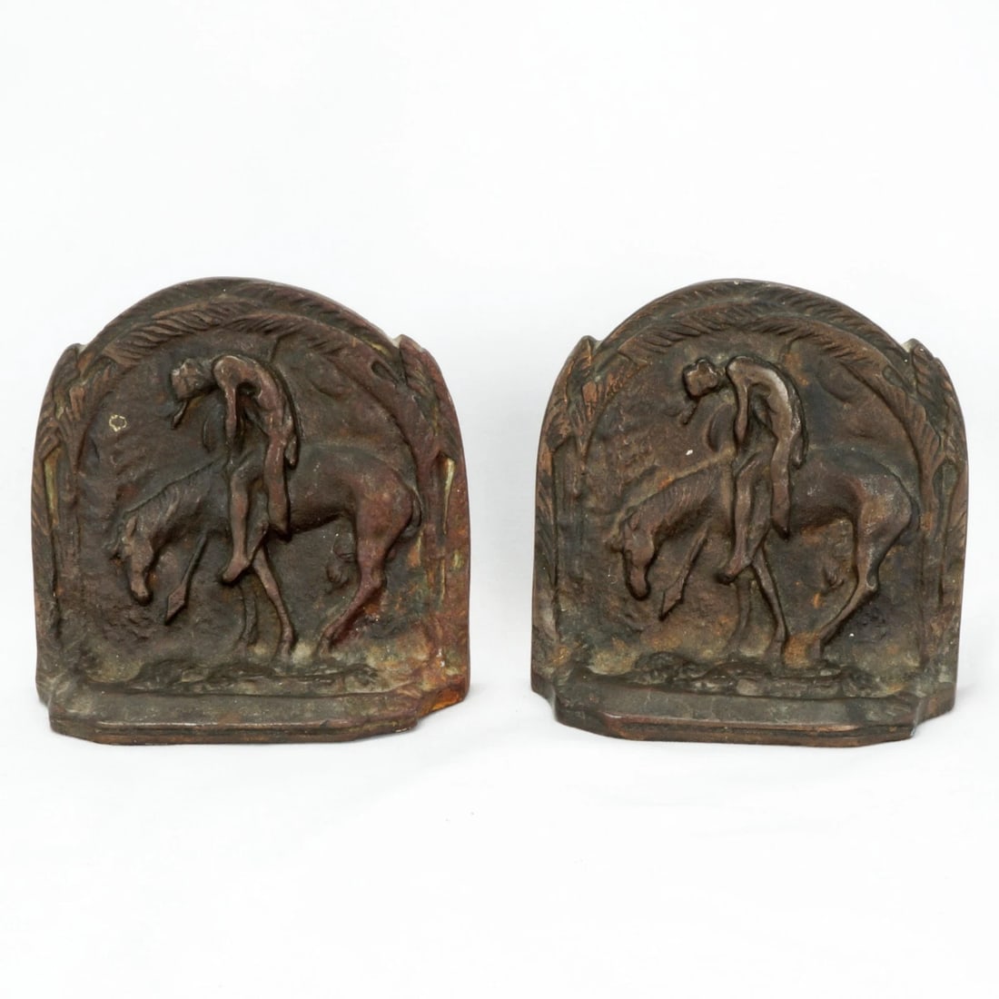 Pair Last Trail Cast Iron Bookends Circa 1930: Title:Pair Last Trail Cast Iron Bookends Circa 1930 Size:4 in (10.2 cm) long x 1 ¾ in (4.4 cm) deep x 3 ¾ in (9.5 cm) tall. Description:A heavy pair of cast iron bookends from the 1930's