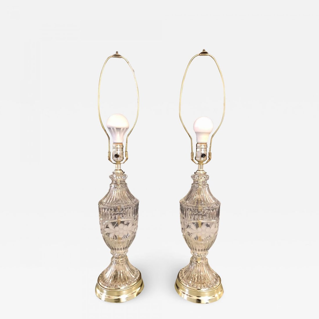 Pair of Cut Glass Lamps Having an Urn Form: Title:Pair of Cut Glass Lamps Having an Urn Form Description:Pair of cut glass lamps having an urn form. Each taking one sixty watt light bulb. More Information:Period: 1920-1949 Condition: Wear consi