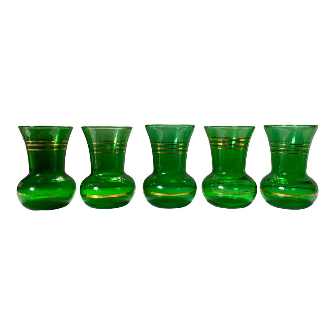 1930s Green Glass Gold Gilt Decorated Vases - Set of 5: Set of five 1920s, bottle green and gold gilt flower vases. Very lovely and useful spread around a table, clustered together or lined up on a ledge with blooms. Condition: Alterations: Original Condit