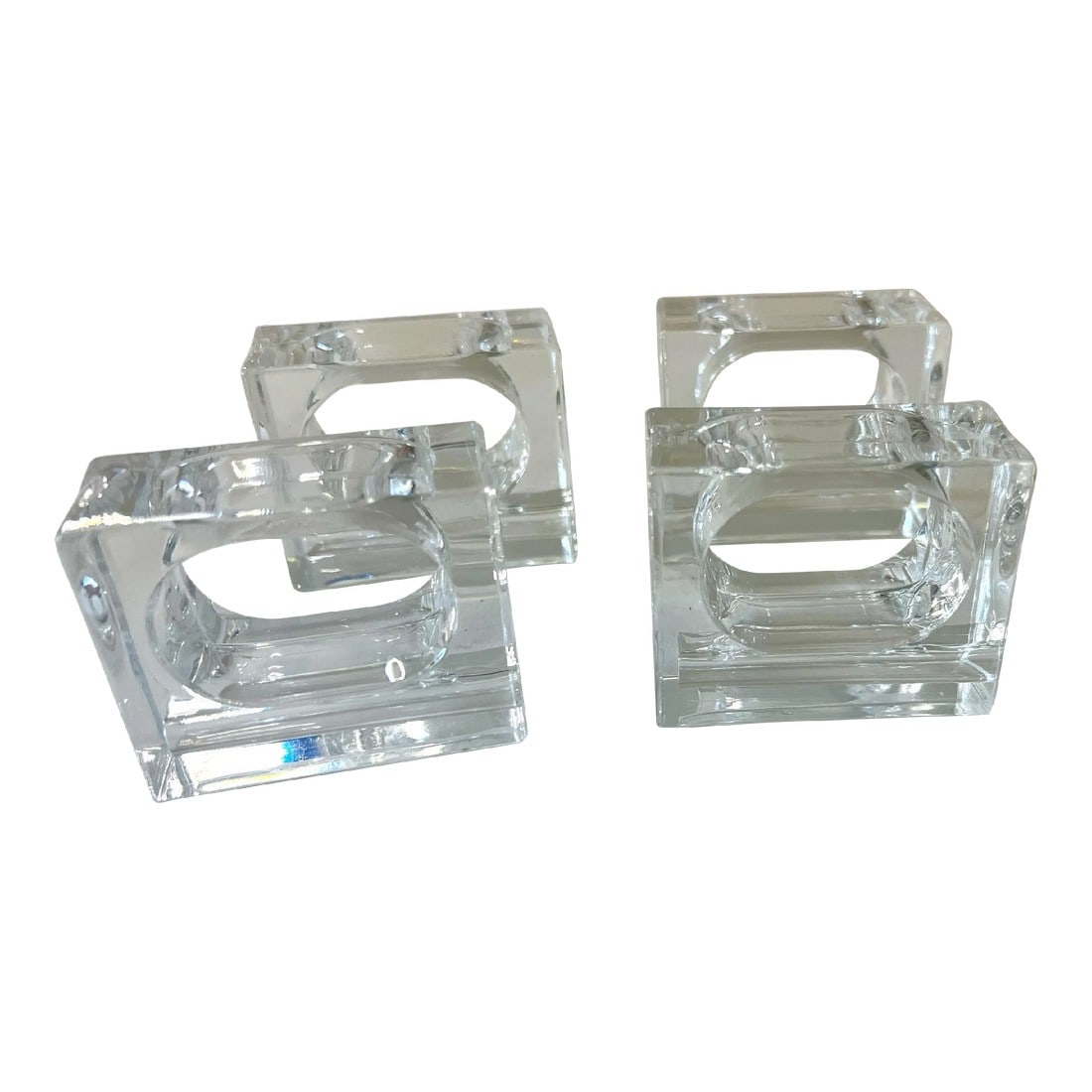 Set of 4 Mid-Century Polished Lucite Napkin Rings Holders, Usa, Circa 1960s: Stunning set of four Mid-Century Modern napkin rings or napkin holders with a geometric design. Rendered in polished transparent clear lucite. The design is rectangular in shape on the exterior with a