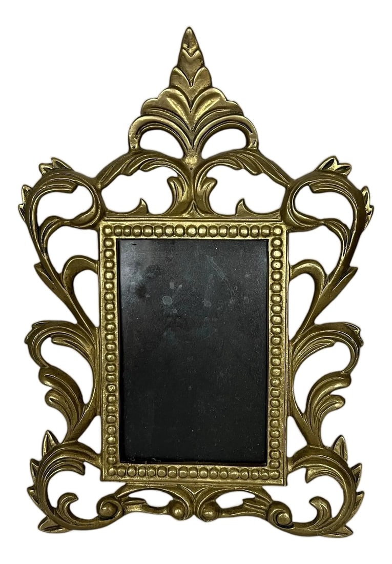 Vintage Reticulated Heavy Brass Picture Frame.: Vintage brass reticulated picture frame with bead edge around the picture frame portion. Great for bookshelves or tabletop. Nice heavy weight brass. Laying flat measures 9" w x .5" d x 12" h Standing