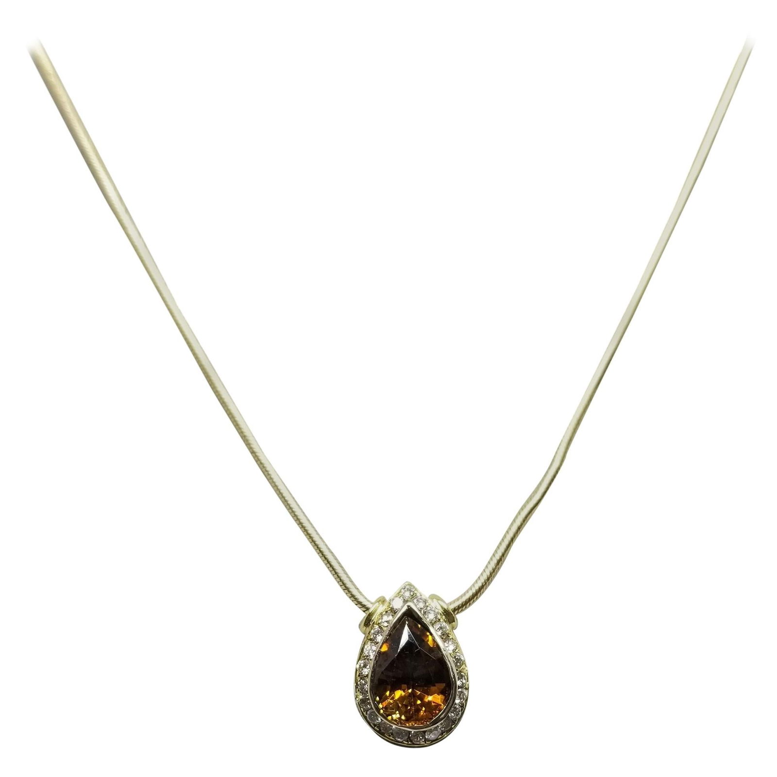 14 Karat Golden Spinel and Diamond Necklace: Title: 14 Karat Golden Spinel and Diamond Necklace Description: 14 karat golden spinel and diamond necklace, containing 1 pear shape cut golden spinel of gem quality weighing 1.10cts. and 23 round ful