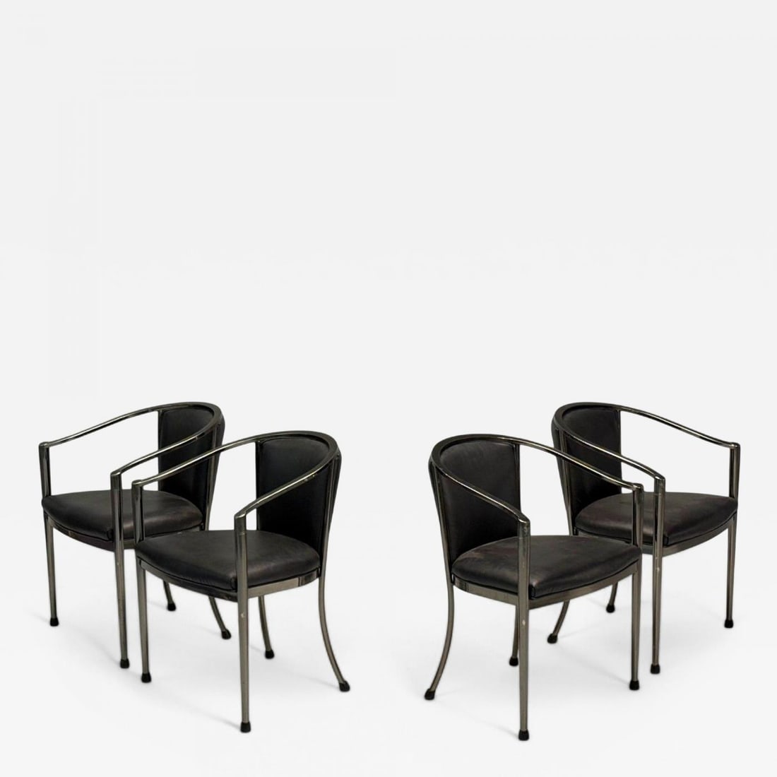 Karl Springer Style, Mid-Century Modern, Gunmetal, Leather, Armchairs, 20th c.: Description: Karl Springer Style, Mid-Century Modern, Gunmetal, Leather, Four Armchairs, USA, 20th c. Set of four modernist armchairs in gunmetal and black leather. Similar in style to work by America