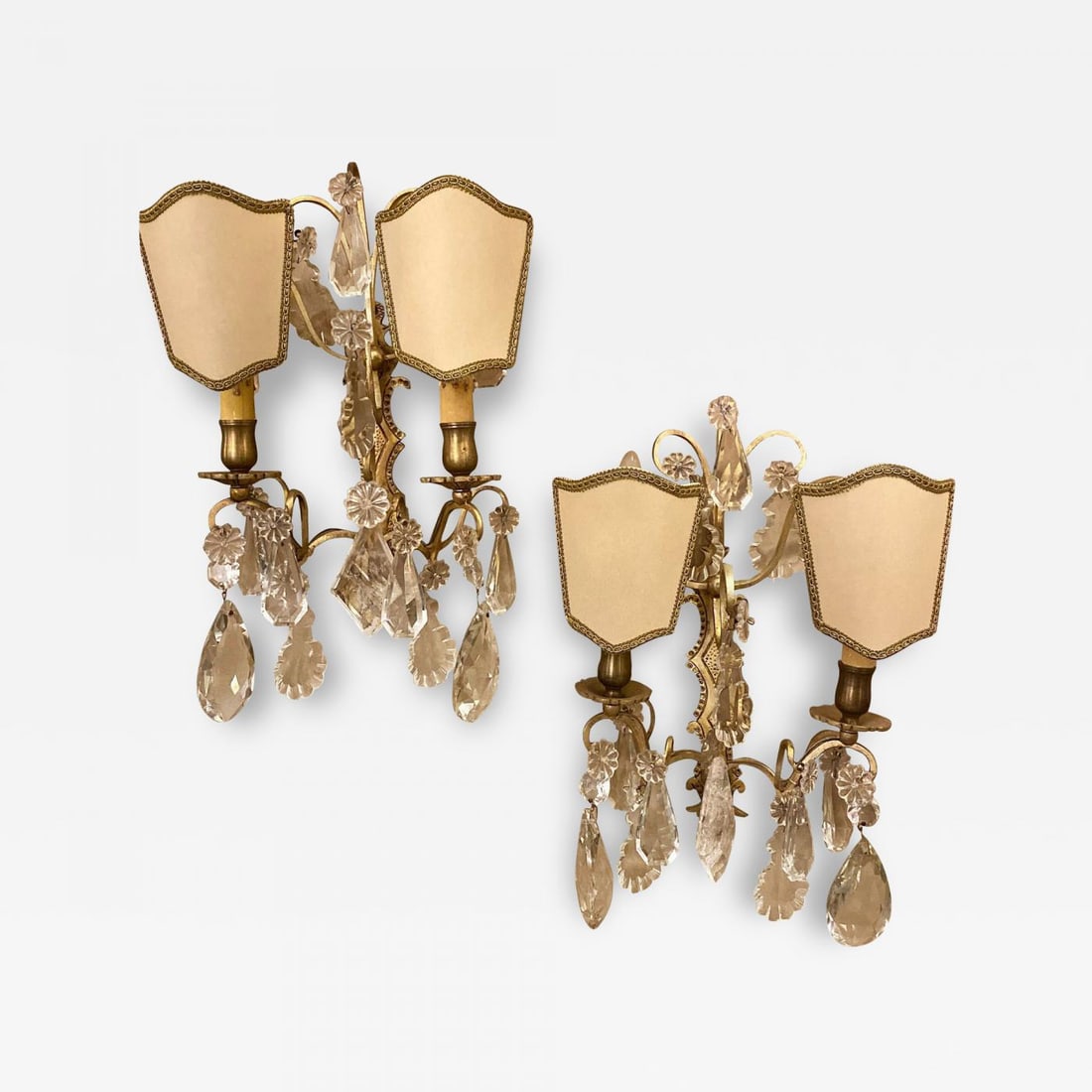 Pair of Two-Light Covered Mixed Crystal and Rock Crystal Bronze Wall Sconces: Description: Pair of two light covered mixed crystal and rock crystal bronze wall sconces each having matching shield shade covers with solid bronze back plates. 1SX. More Information: Period: 1920-19