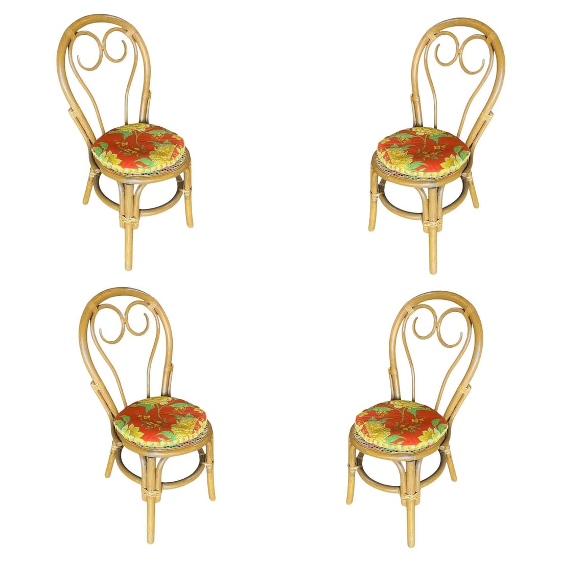 Restored Rattan Dining Chairs with Scrolling Back, Set of 4: Set of four vintage rattan dining room chairs, each chair features a removable padded seat and a Thonet-style scrolling back seat. 1950, United States We only purchase and sell the best and finest rat