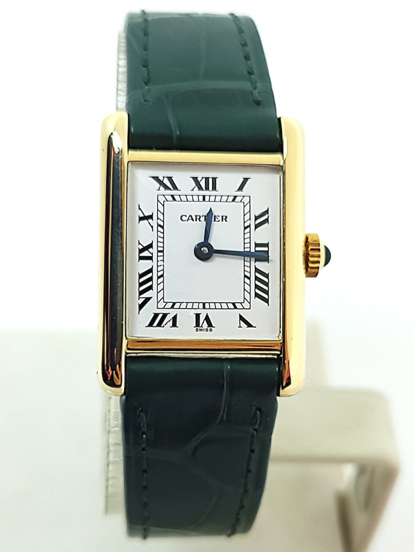 Solid 18k CARTIER PARIS TANK Ladies Winding Watch 20.5 mm EXLNT* Original Band: Solid 18k CARTIER PARIS TANK Ladies Winding Watch 20.5 mm EXLNT* Original Band​​ This Ladies CARTIER watch is Swiss made. Great present for yourself or someone you love! * Solid 18k yellow