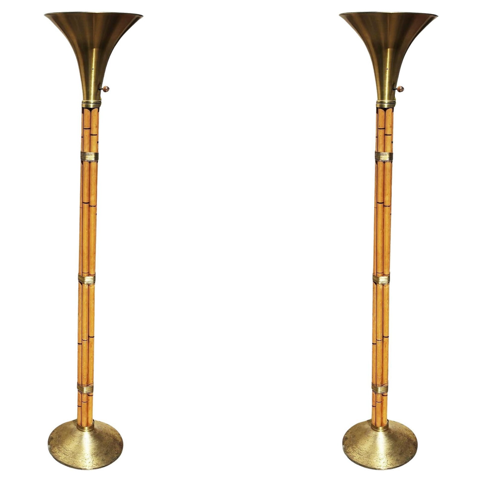 Restored Stacked Rattan Torchère Floor Lamps Brass Shade by Russel Wright, Pair: Restored Russel Wright Designed Brass and Rattan Mid-century torchère floor lamps. Crafted with 6 stacked rattan poles mounted to a brass base with brass wrappings and topped off with a spun alum