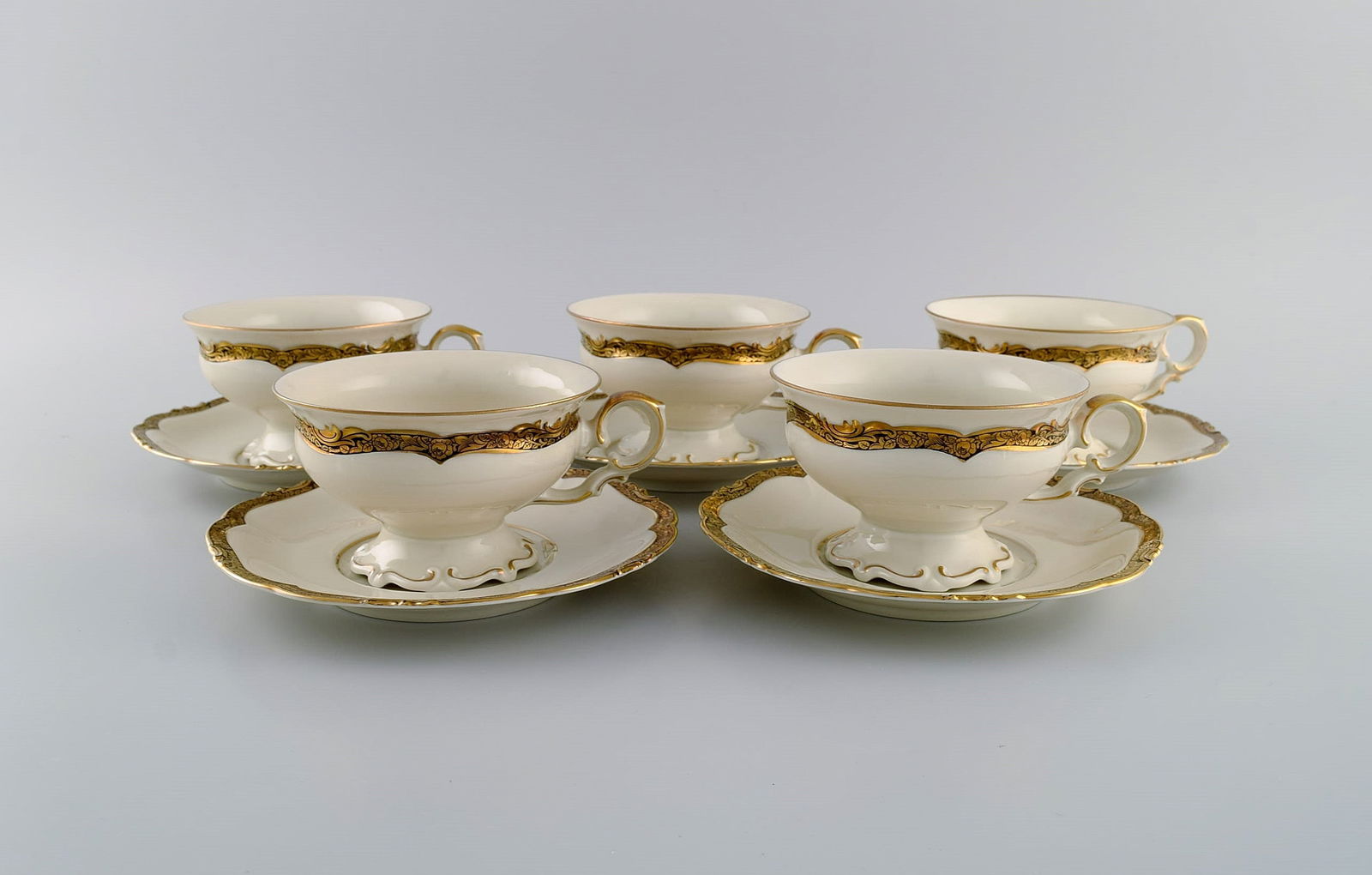 KPM, Berlin. Five Royal Ivory teacups with saucers in cream-colored porcelain with gold decoration. (1 of 5)