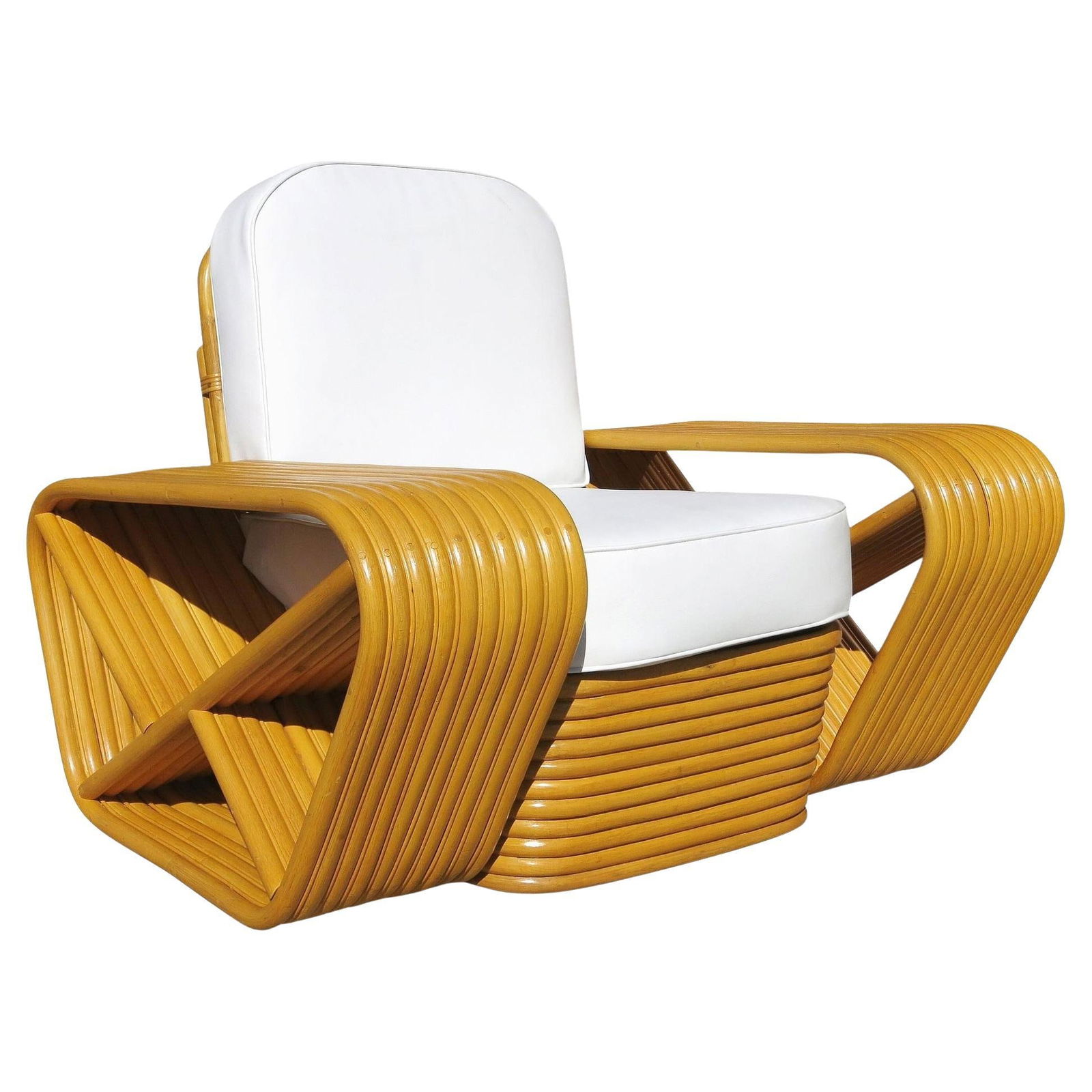 Restored 10 Strand Square Pretzel Rattan Lounge Chair Paul Frankl Style: Beautifully restored Paul Frankl style rare ten-strand square pretzel rattan lounge chair with stacked rattan base. The chair blends style and vintage charm with modern comfort and features the iconic