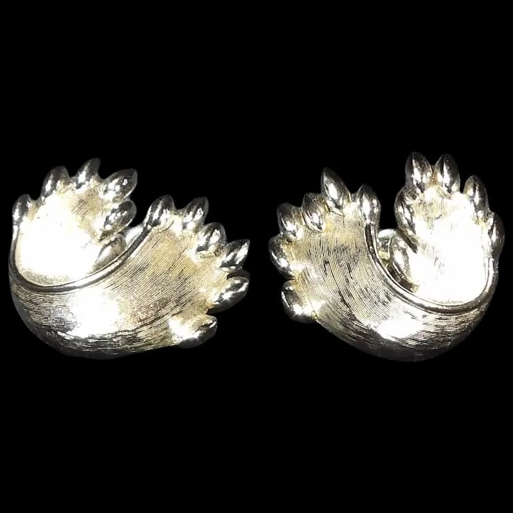 Vintage 1960’s Crown Trifari Clip on Earrings- Silver Tone: This pair of 1960’s Crown Trifari Clip on Earrings- Silver Tone are in excellent condition. Trifari is one of the highest quality producers of costume jewelry of the Mid-Century period. They mea