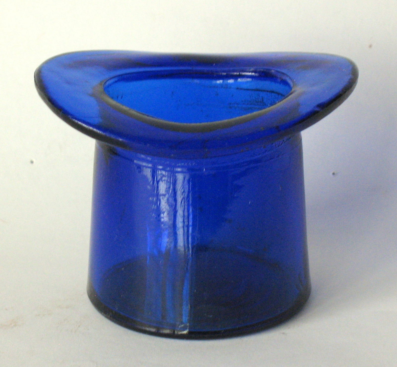 Vintage blue glass top hat shaped toothpick holder.: Title: Vintage blue glass top hat shaped toothpick holder. Date/Period: 1940's Dimension: 3” x 2 1/2” Additional Information: Nice vintage blue glass top hat shaped toothpick holder in goo