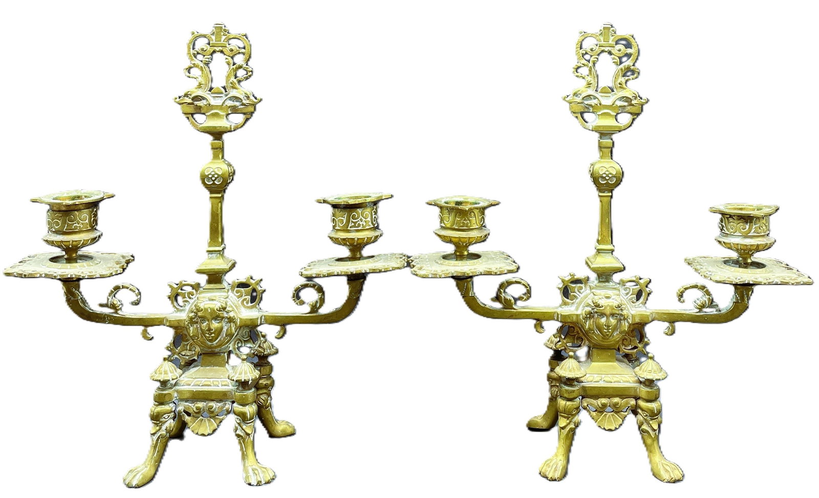 Exceptional Pair Brass Candlesticks Footed with Face detail: Date/Period: unknown Dimension: Approx. 9.5 tall x 8.5" wide x 3" deep Material: brass Additional Information: Exceptional Pair Brass Candlesticks Footed with Face detail Shipping: Domestic: Flat-rate