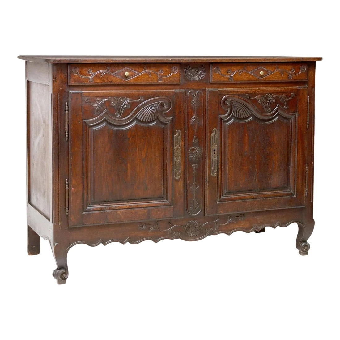Antique French Provincial Louis XV Style Oak Sideboard: French Louis XV style oak sideboard, late 19th c., two drawers, over two cabinet doors, scalloped apron, rising on whorl feet. Detailed carving on each door panel. Dimensions: approx 39"h, 54"w, 22.5"