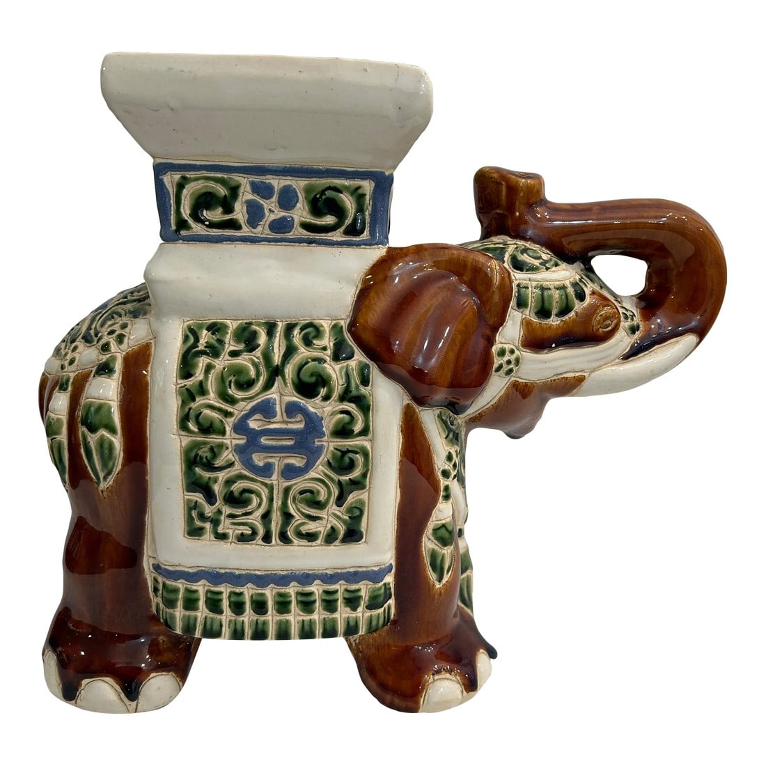 Late 20th Century Petite Elephant Garden Stool Plant Stand: This small elephant stool plant stand is the perfect size to dress up a corner or tabletop. The colors are unusual, brown but this time with green and blue. Of course, the trunk is up for good luck. I
