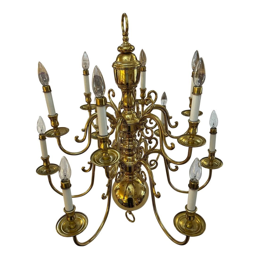 Late 20th Century Solid Brass Williamsburg Georgian Style 12 Arm Chandelier Attributed to Chapman: This is a very large vintage brass chandelier bearing 12 lights in 2 tiers and weighing approximately 30 lbs. The style and quality of design lead us to believe it was made by Chapman, though there is