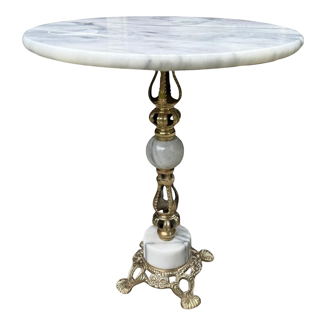 Hollywood Regency Reticulated Brass & Marble Petite Drinks Table: Hollywood Regency brass drinks table featuring a round Carrara marble top. The footed pedestal base is decorated with a reticulated open fretwork pattern alternating with marble in geometric shapes. T
