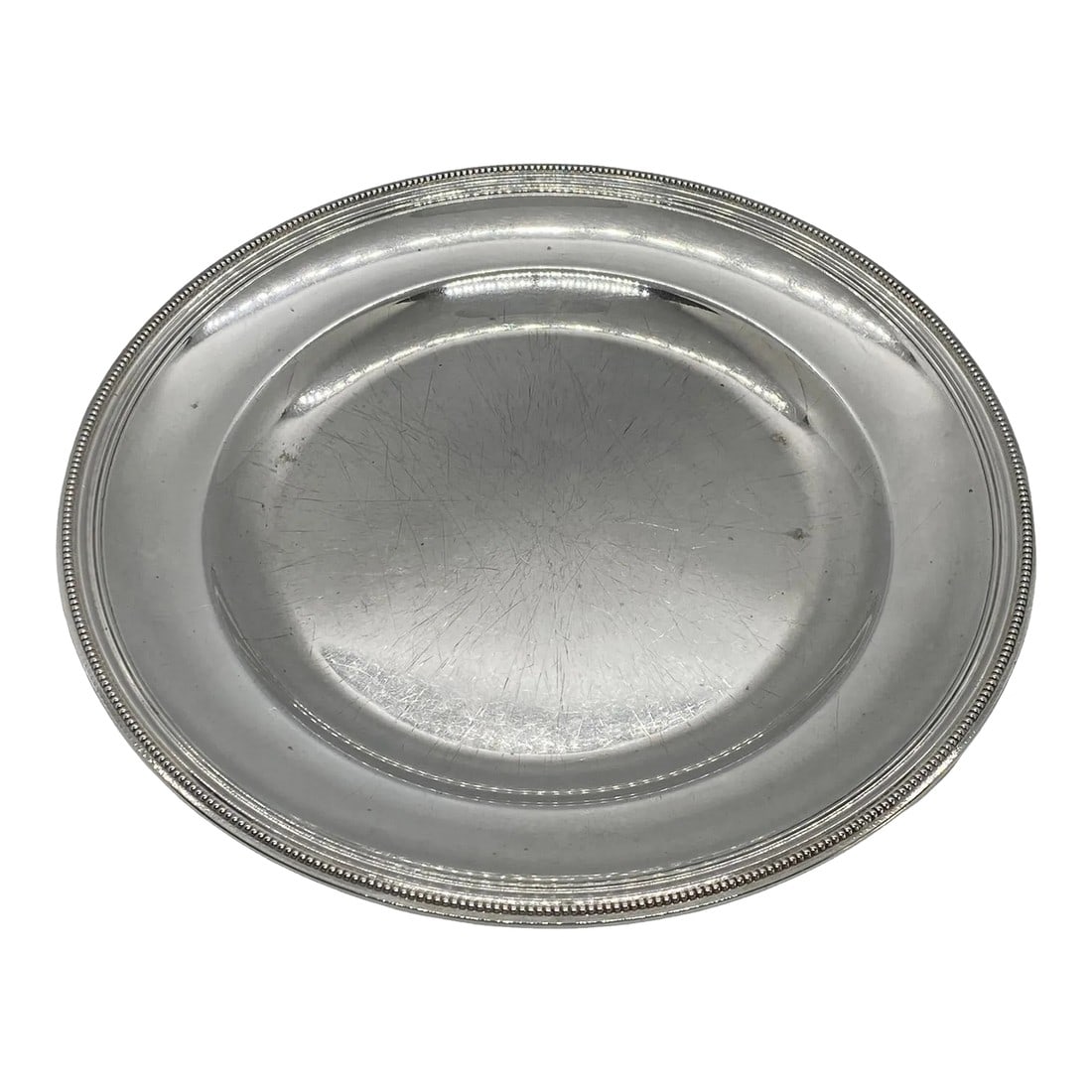 1940s French Christofle Perles Silverplate Louis XVI Style Serving Tray: French Christofle Perles Silver Plate Louis XVI Style Serving Tray. The lovely round tray measures 10 5/8" Wide x 1" Tall. The "Perles" Pattern was introduced by Christofle in 1890. This tray dates to