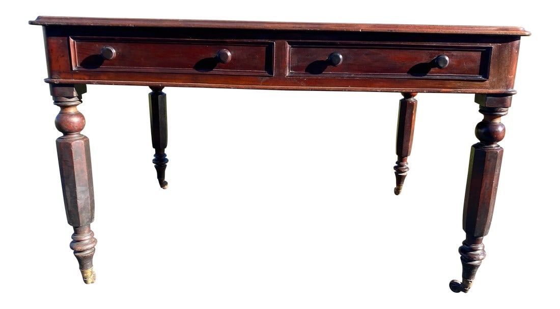 Antique William IV Writing Desk.: Antique Writing Desk Mahogany with two working drawers on the front and false drawers on the reverse. Brass. Castors and a newly installed fabric top. Dense fiddled mahogany on the top surface Origina