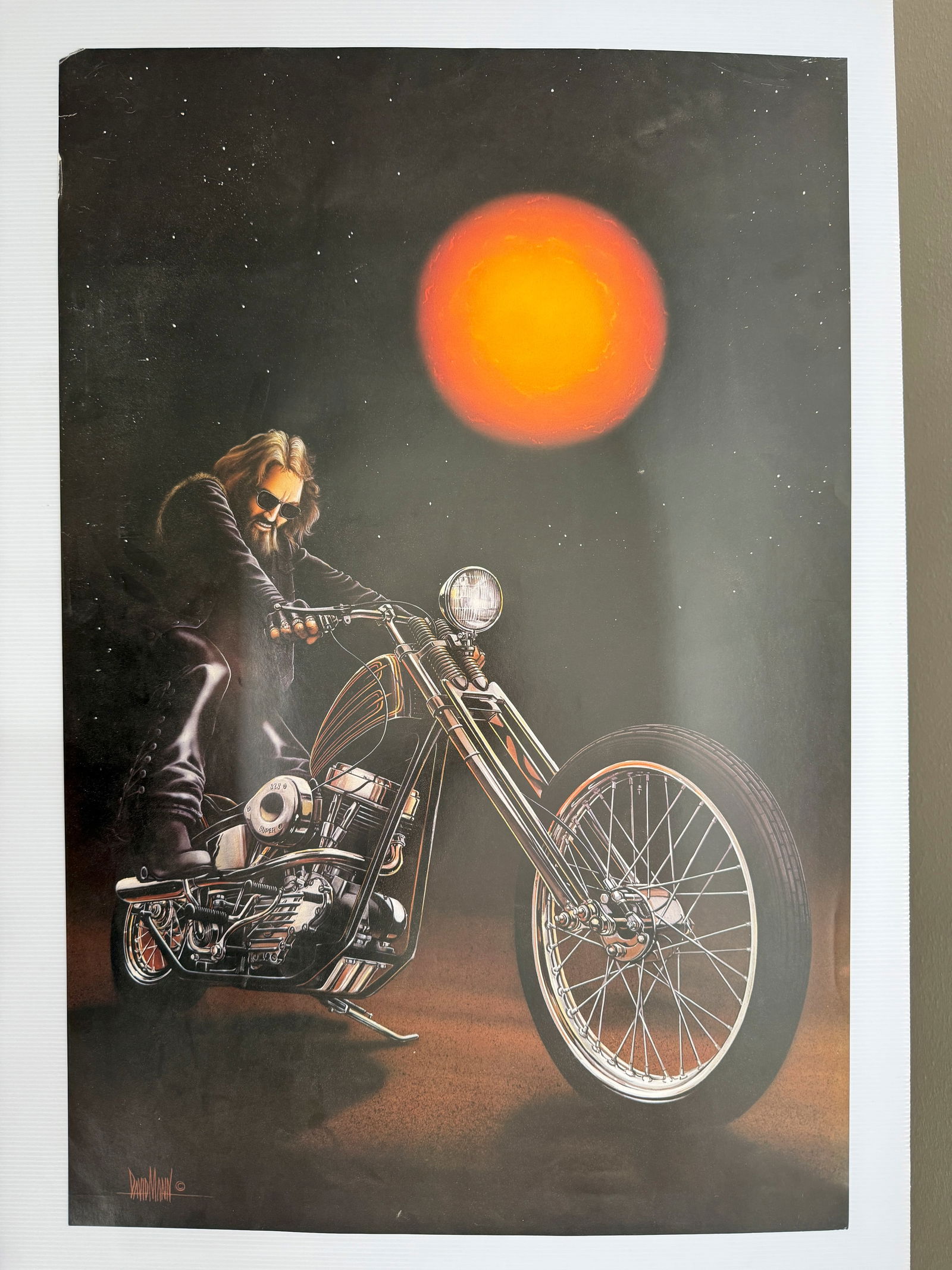 KICK START BY DAVID MANN: Title: KICK START BY DAVID MANN Description: This is a print of the iconic biker painting "Kick Start" by artist David Mann. The artwork originally appeared as a centerfold in the May 1979 issue of Ea