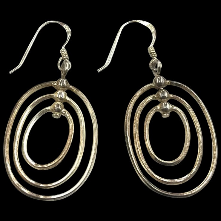 Vintage Triple Oval Hoops Earrings: Title: Vintage Triple Oval Hoops Earrings Description: Vintage Triple Oval Hoops Earrings Hallmarked 925 Sterling Silver Weighs 4 Measures 1.75 x .90 inches Pierced Closure Date/Period: Vintage Materi