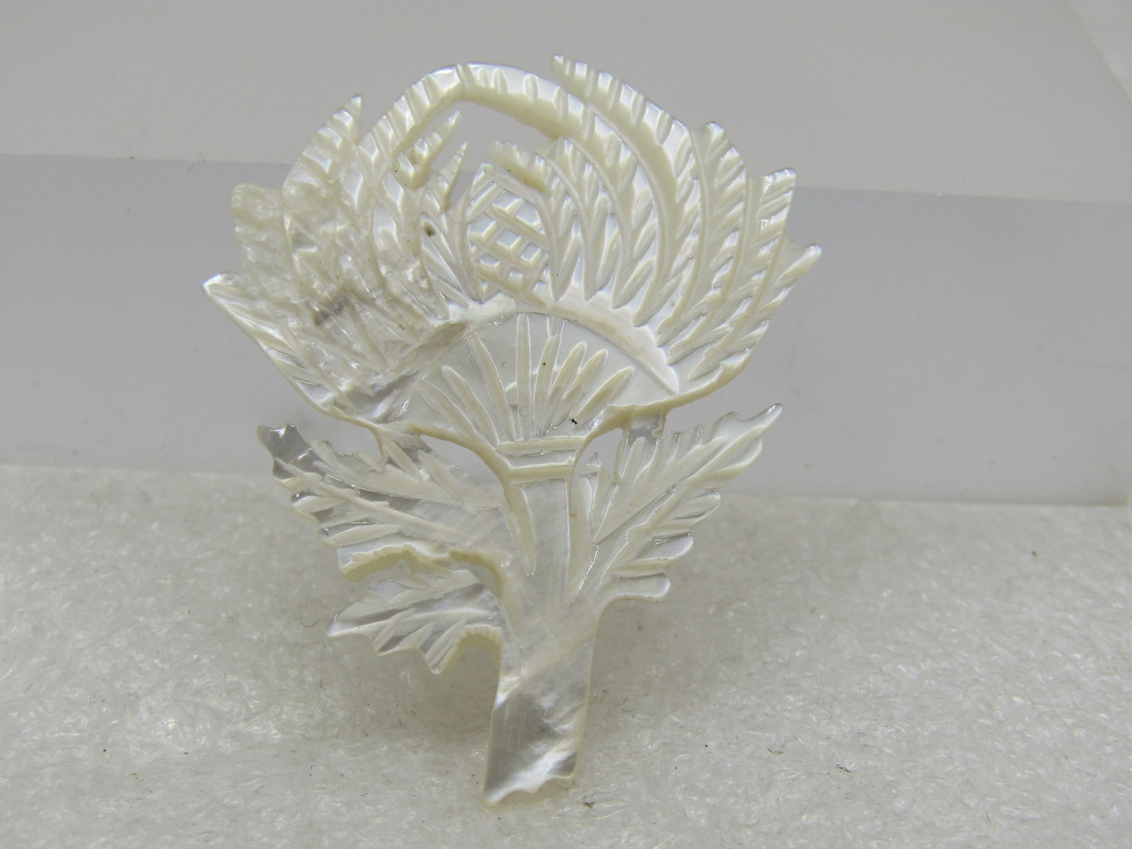 Vintage Carved Thistle Brooch, Mother-of-Pearl, 1960's: Title: Vintage Carved Thistle Brooch, Mother-of-Pearl, 1960's Description: Vintage Carved Thistle Brooch, Mother-of-Pearl, 1960's, 1-7/8" tall and 1.5" wide. Thistles are a very Scottish thing and man