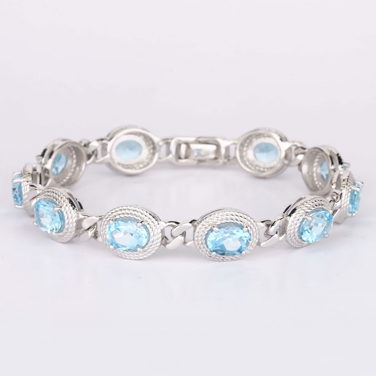 Bracelet: Blue Topaz Oval 8x6mm: Item:Bracelet Description: Blue Topaz Oval 8x6mm - 10Pcs Date/Period: After 2000 Material: 925 Silver W/Rhodium Gross Weight: 17.3 Metal Weight: 14.5 Reserve: $47.00 Shipping: Domestic: Flat-rate of $