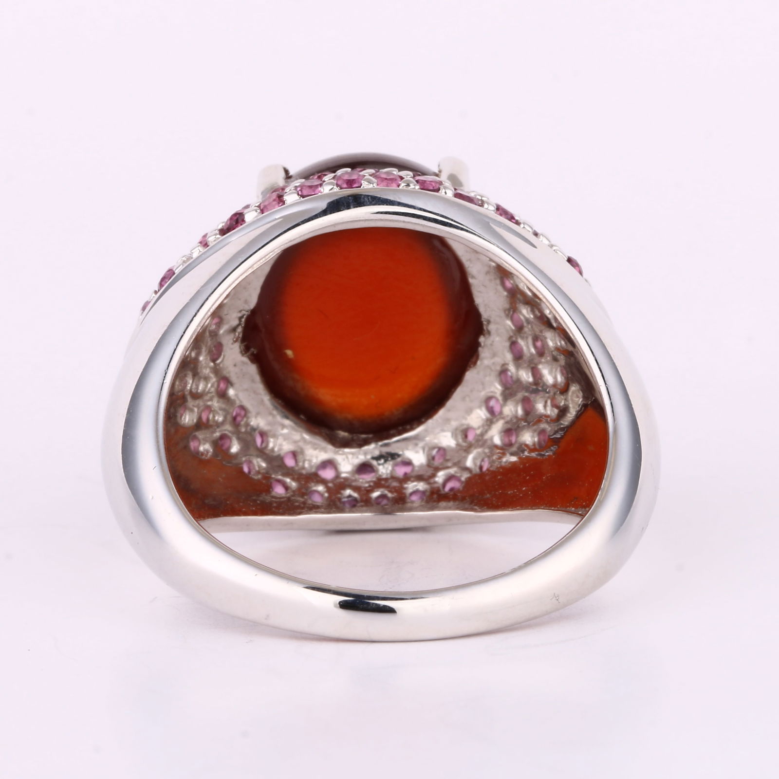 Ring: Hessonite CAB Oval 14x12mm: Item:Ring Description: Hessonite CAB Oval 14x12mm - 1Pc + Rhodolite Round 1.60mm - 60Pcs + Rhodolite Round 1.40mm - 8Pcs Date/Period: After 2000 Material: 925 Silver W/Rhodium Gross Weight: 8.88 Metal