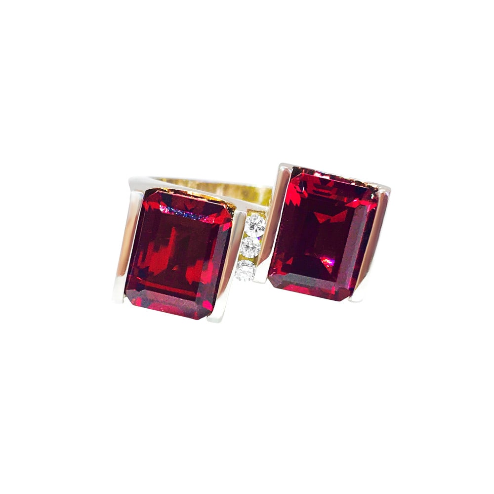 14K Gold, 7 Carat Natural Garnet and Diamond Ring.: Title: 14K Gold, 7 Carat Natural Garnet and Diamond Ring. Description: 14K White Gold. 7.00 Carat Natural Garnet, Emerald Cut. 100% Natural earth mined. Setting: Channel. Diamonds: 1/10 carat. VS clar