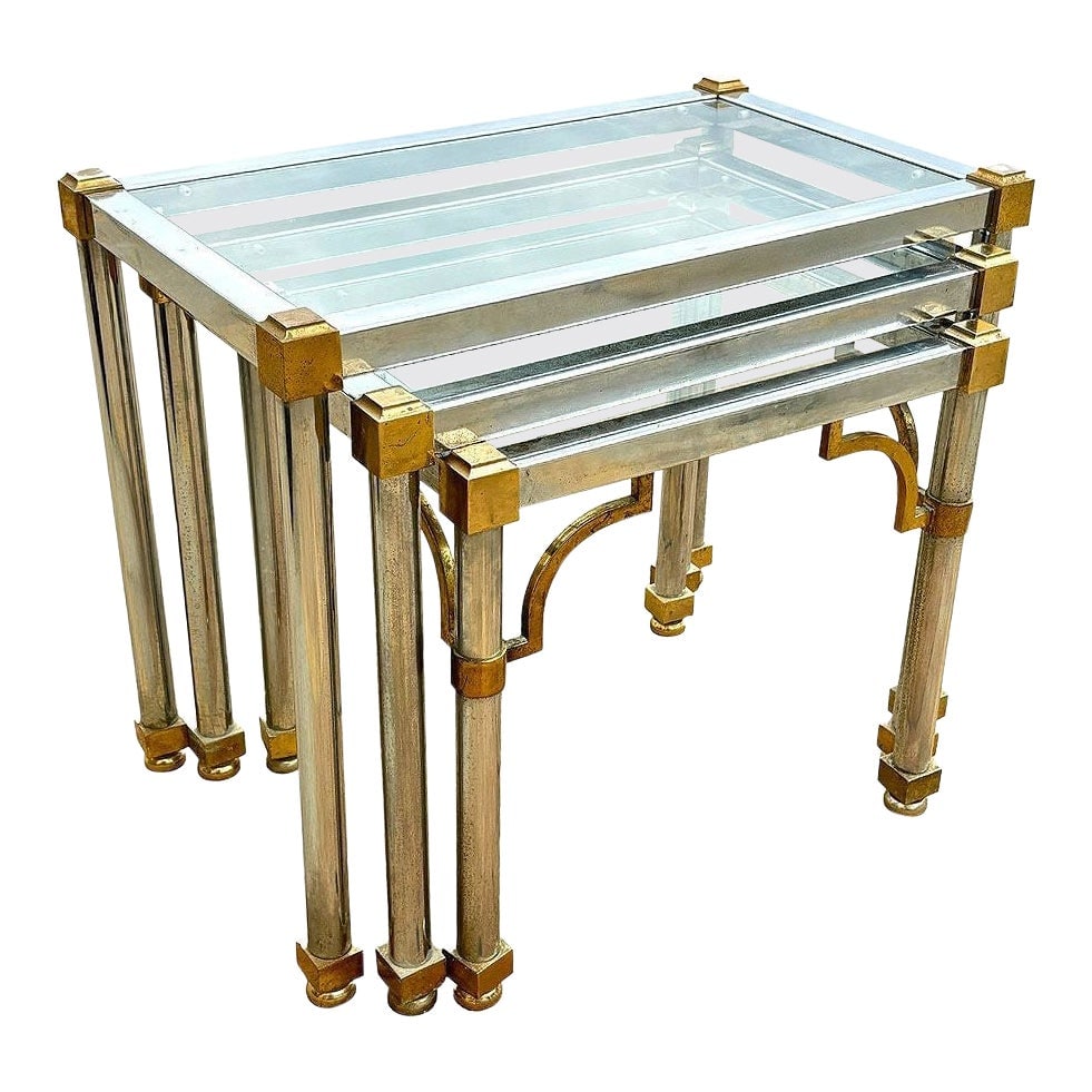 Hollywood Regency Chrome & Brass Maison Jensen Style Nesting Tables: Title: Hollywood Regency Chrome & Brass Maison Jensen Style Nesting Tables Description: Set of 3 Mid-century/Hollywood Regency chrome & glass nesting tables feature a striking combination of chrome wi