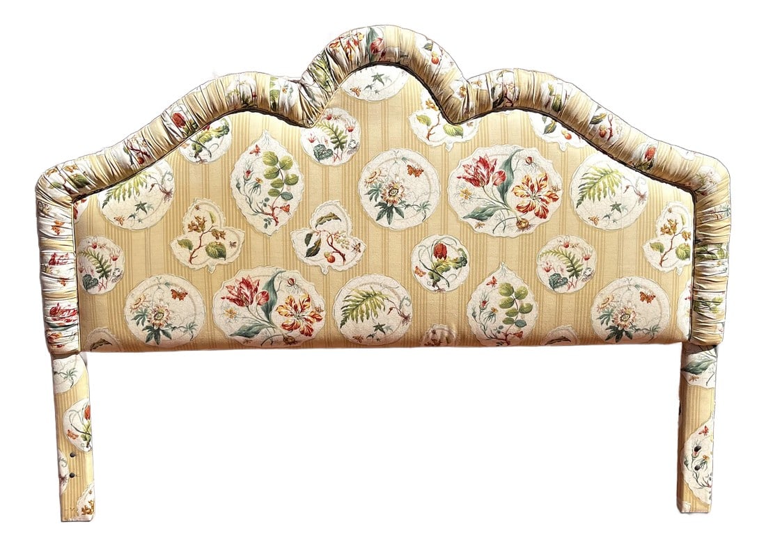 Upholstered King Headboard in Ditchley by Colefax and Fowler 1990s Discontinued: Designer upholstered headboard, featuring luxurious fabric by Colefax & Fowler in a retired pattern called Ditchley. The scalloped silhouette, ruched border and plush, padded frame add a touch of refi