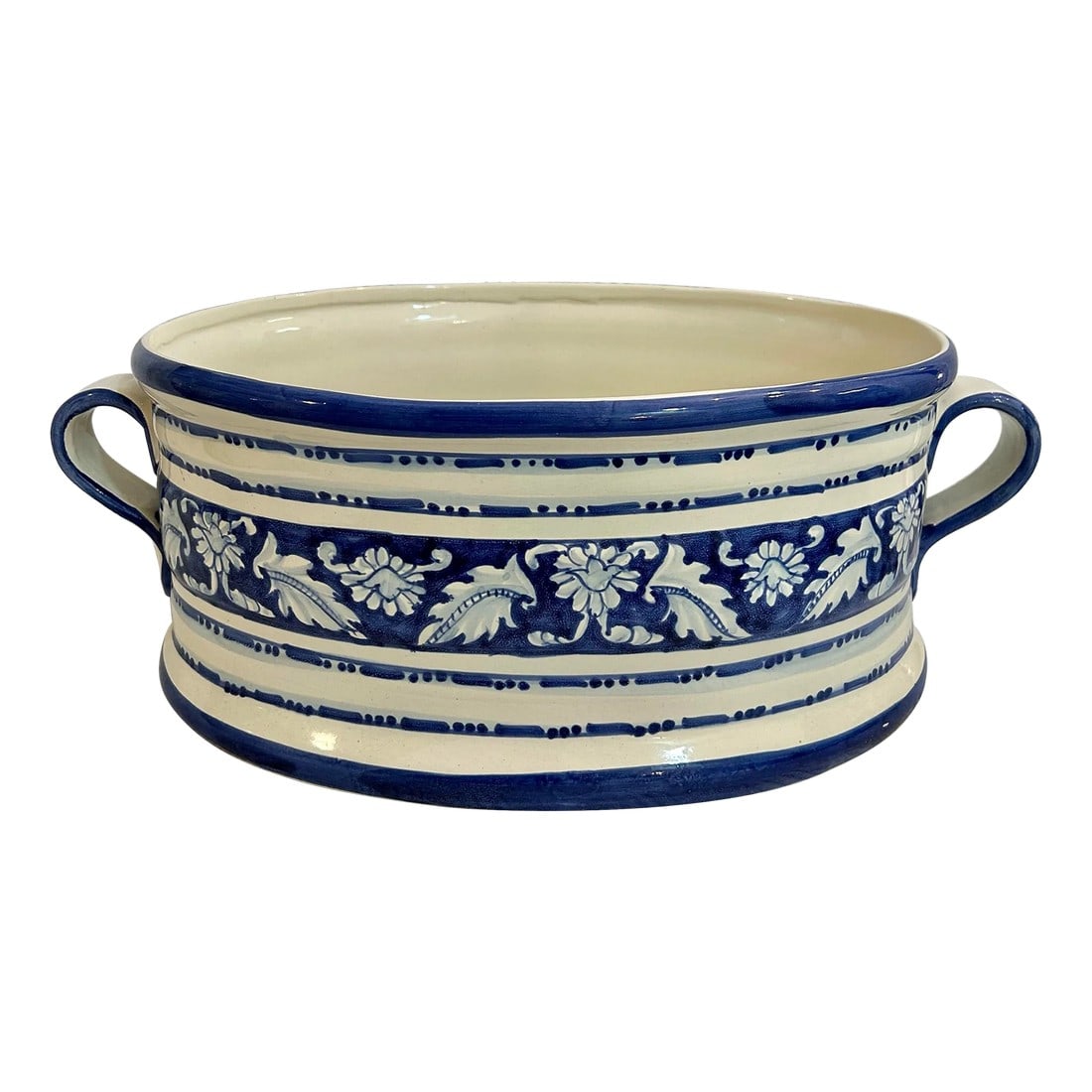 Vintage Large Blue and White Italian Earthenware Cache Pot or Planter: Made in Italy, this large cache pot or indoor planter is so versatile. The beloved blue and white is featured in a hand painted leaf design. The side handles are scrolled. At 16.5" wide, this piece wi