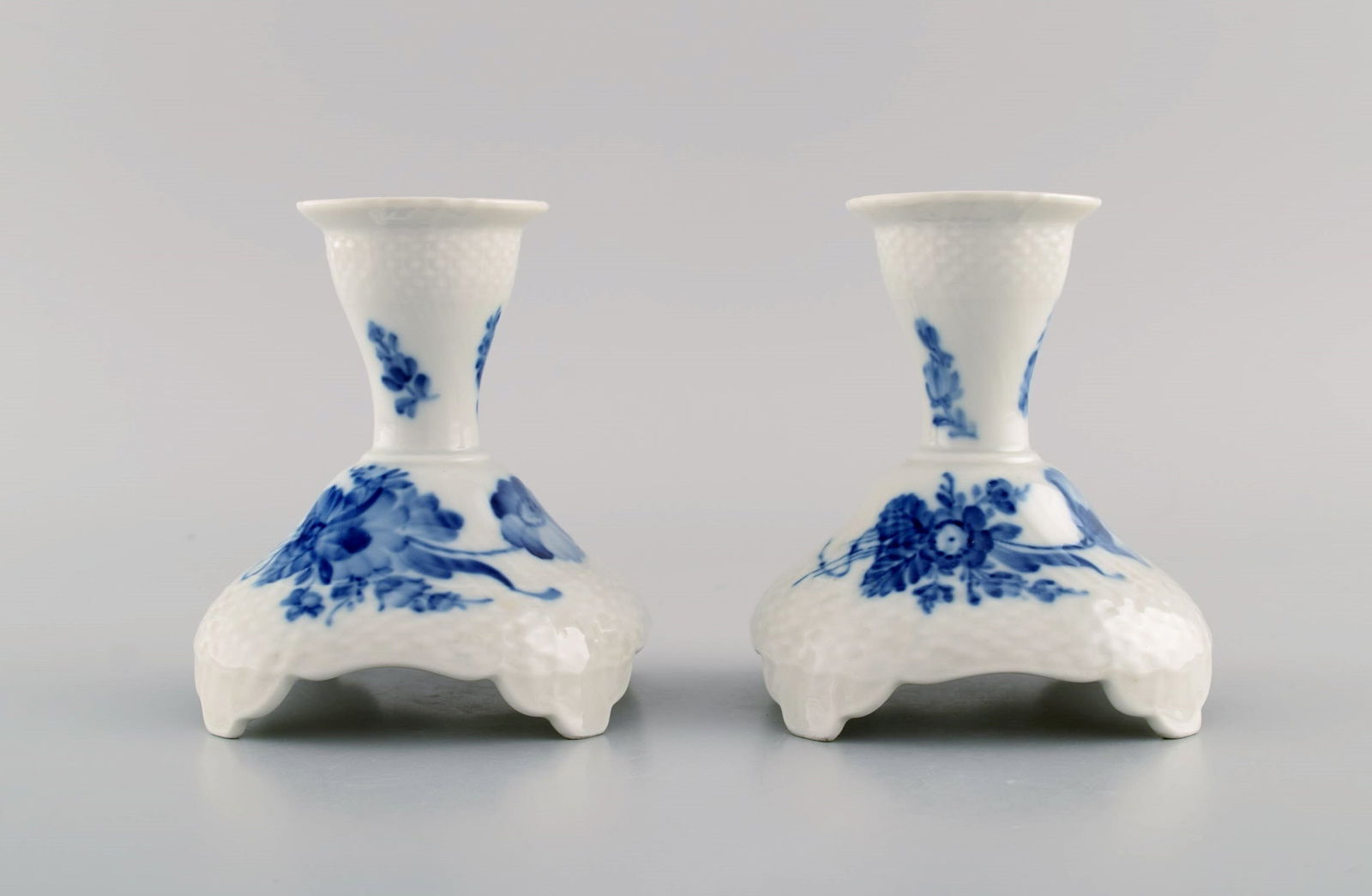 Two Royal Copenhagen Blue Flower Curved candlesticks. Model number 10/1711. Dated 1965.: Two Royal Copenhagen Blue Flower Curved candlesticks. Model number 10/1711. Dated 1965. Measures: 10.5 x 10.5 cm. In excellent condition. Stamped. 1st factory quality. Reserve: $140.00 Shipping: Domes