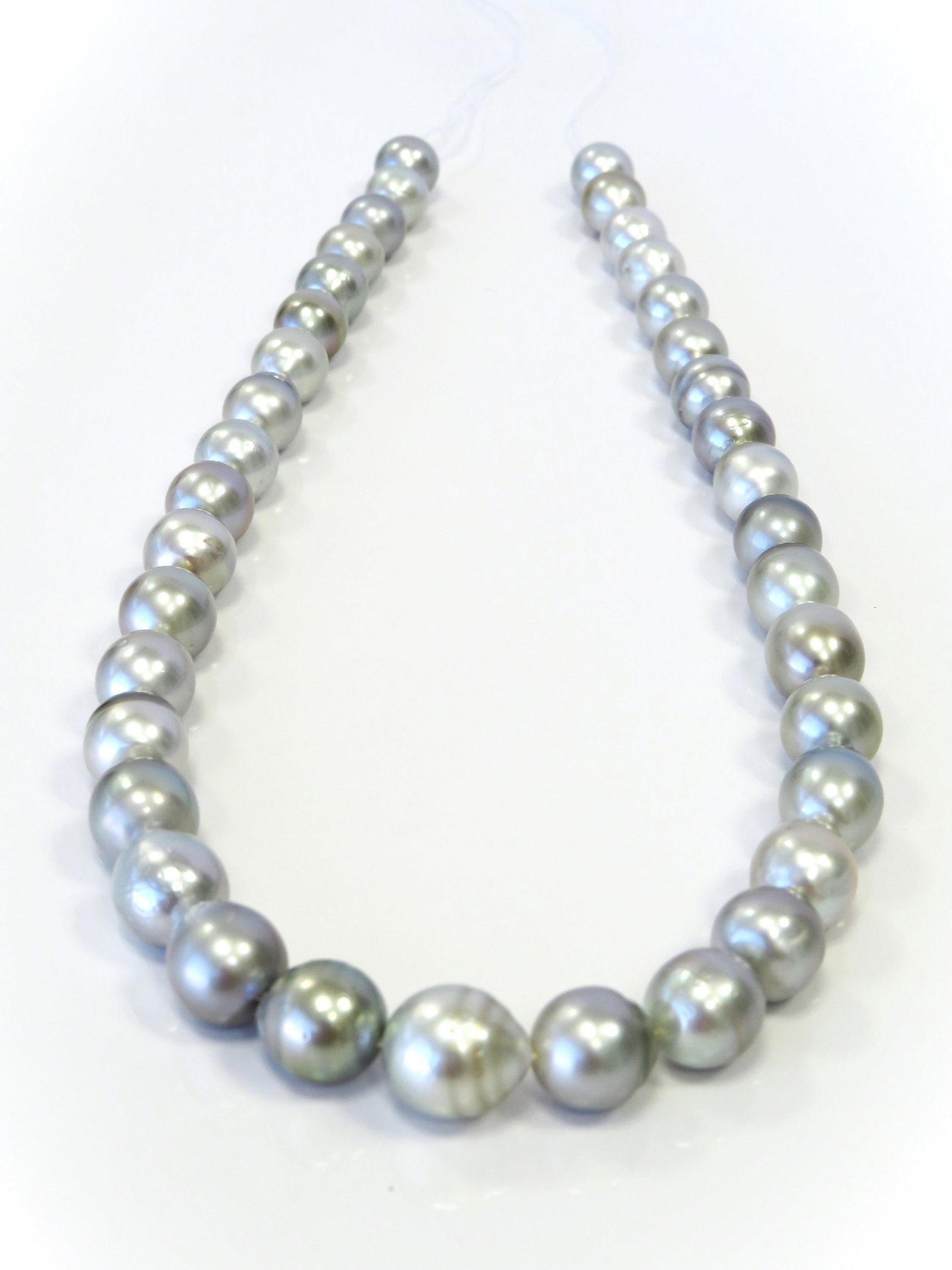 9-11mm Drop/Oval-Circle Silver-Blue Tahitian Pearl Necklace Strand: Title:9-11mm Drop/Oval-Circle Silver-Blue Tahitian Pearl Necklace Strand Description:A-Grade High luster, Drop-Oval-Circle Silver-Blue, with minimal spots/blemishes, 37 pearl pieces, 18 inches long ha