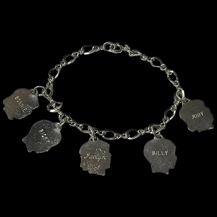 Vintage Mother's Charm Bracelet with Children Boy and Girl Charms: Vintage Mother's Charm Bracelet with Children Boy and Girl Charms Names on Front: Judy Billy Jaclyn Ricky Bonnie-Dates on the Back Hallmarked: Sterling Weighs 12.7 grams Measures 7 inches length Reser