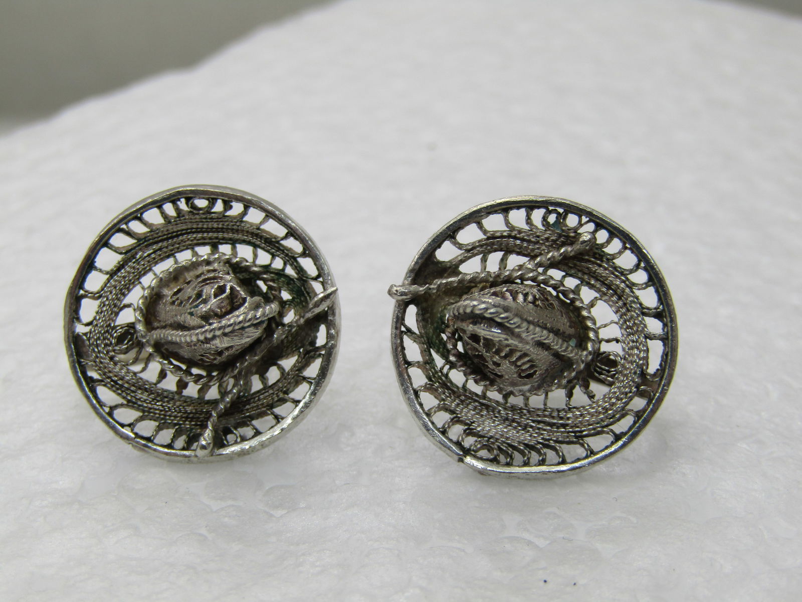 Vintage Sterling Southwestern Sombrero Earrings, Screwback, 3/4": Vintage Silver Southwestern Sombrero Earrings, Screwback, 3/4", filigree design. Appx. 8.81 grams. 1950's-1960's. These are between .800 to .925 silver. Test as silver but it has been my experience wh